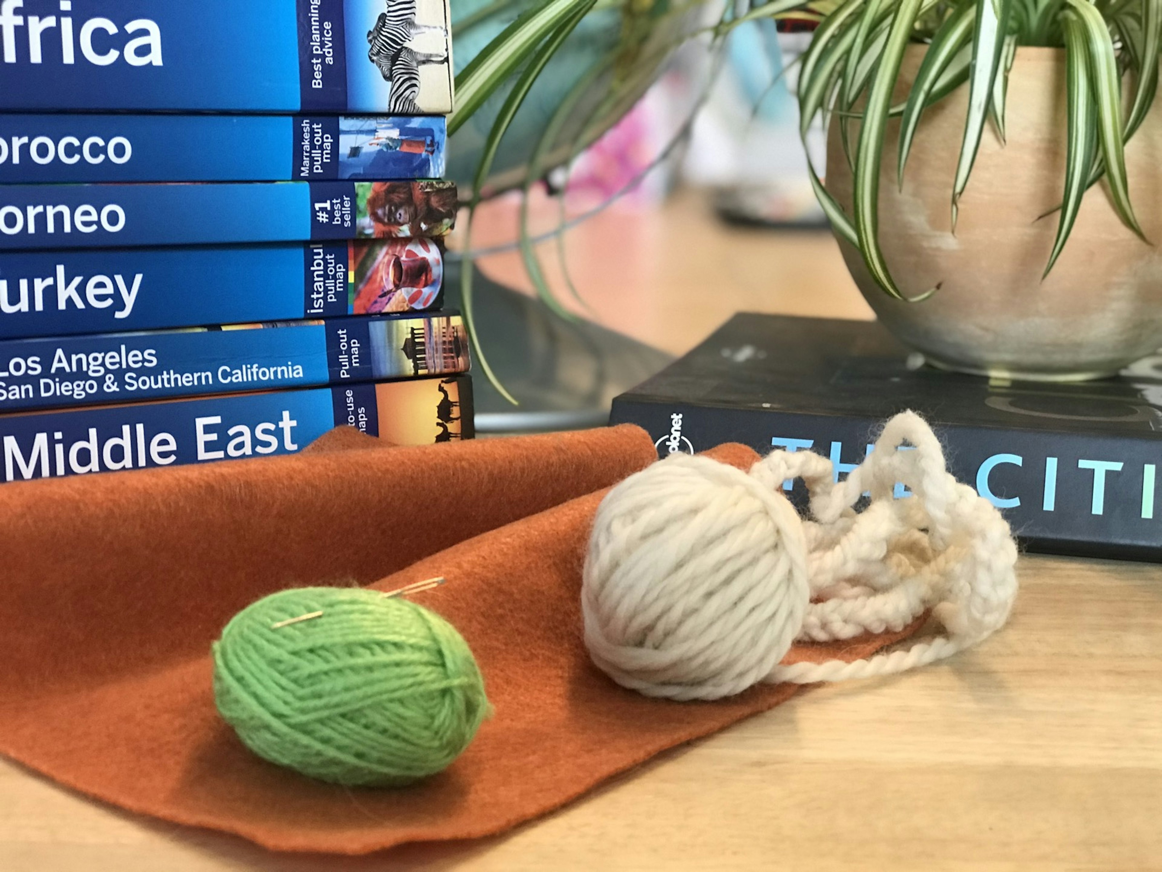 A piece of felt and two spools of yarn