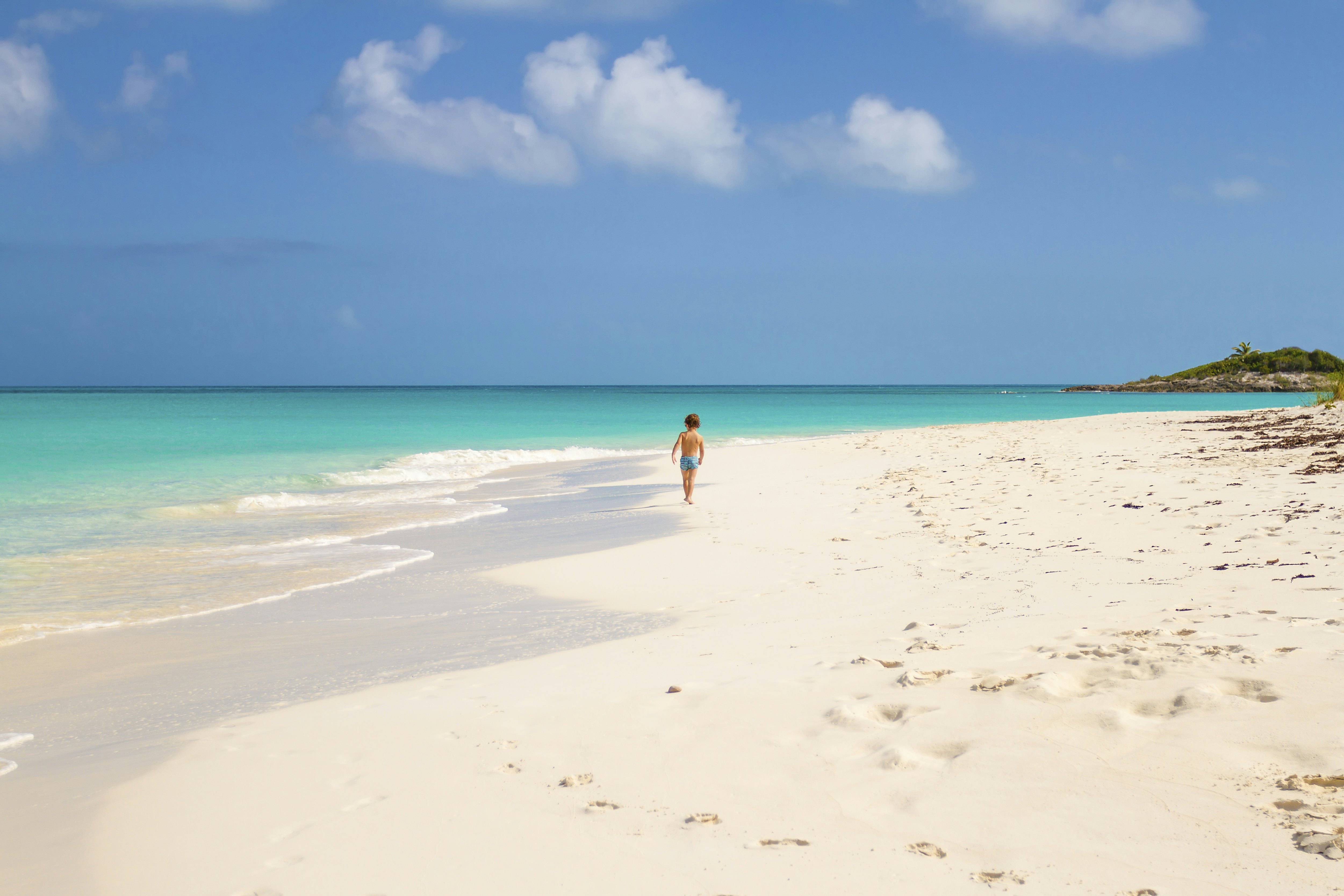 Child running in Tropic of Cancer Beach - Bahamas