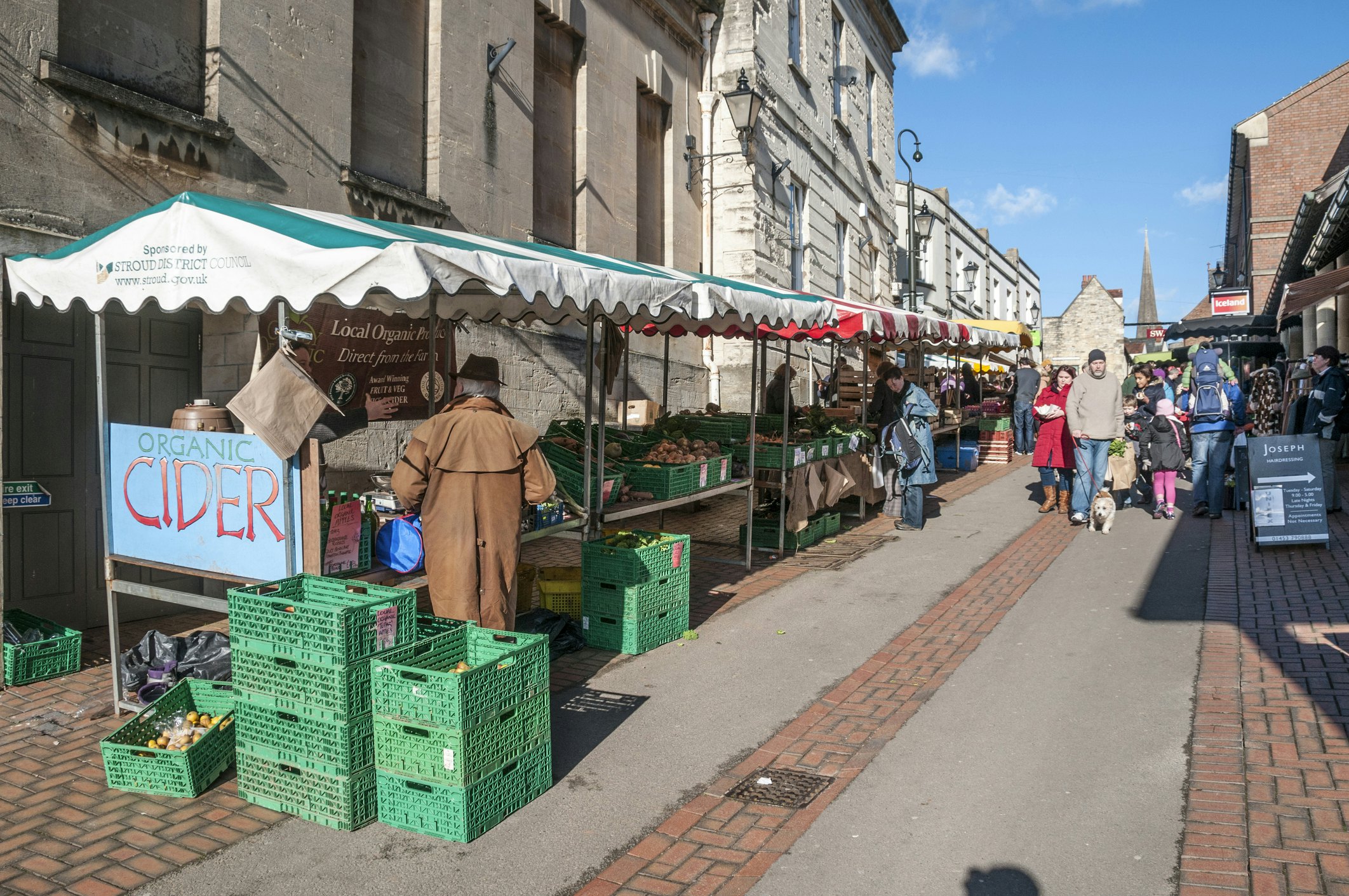 Pedestrians shopping at the busy weekend farmers market in Stroud, the Cotswolds, England, United Kingdom