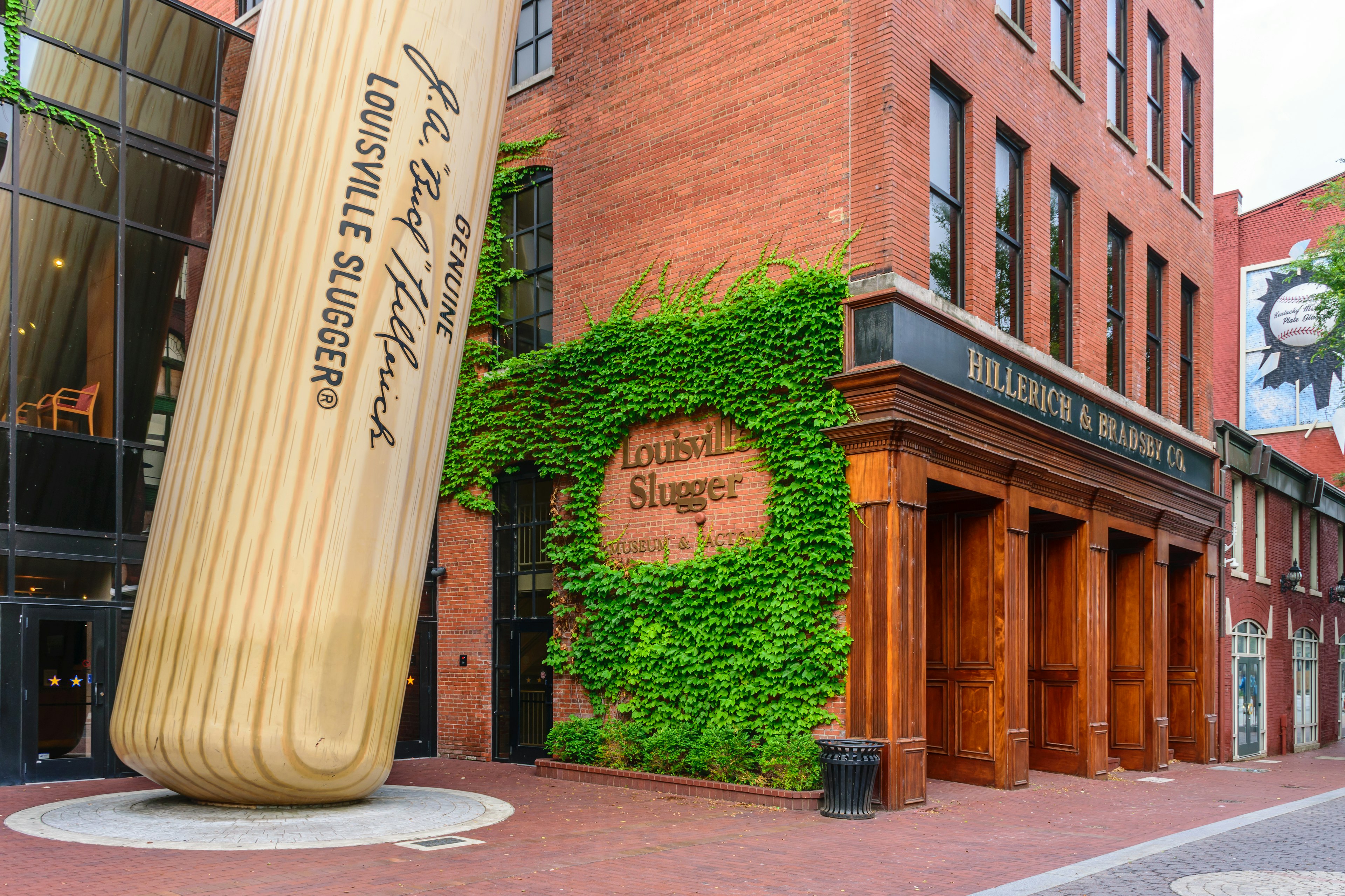 Exterior of the Louisville Slugger Museum & Factory in downtown Louisville, Kentucky including a giant baseball bat propped up outside