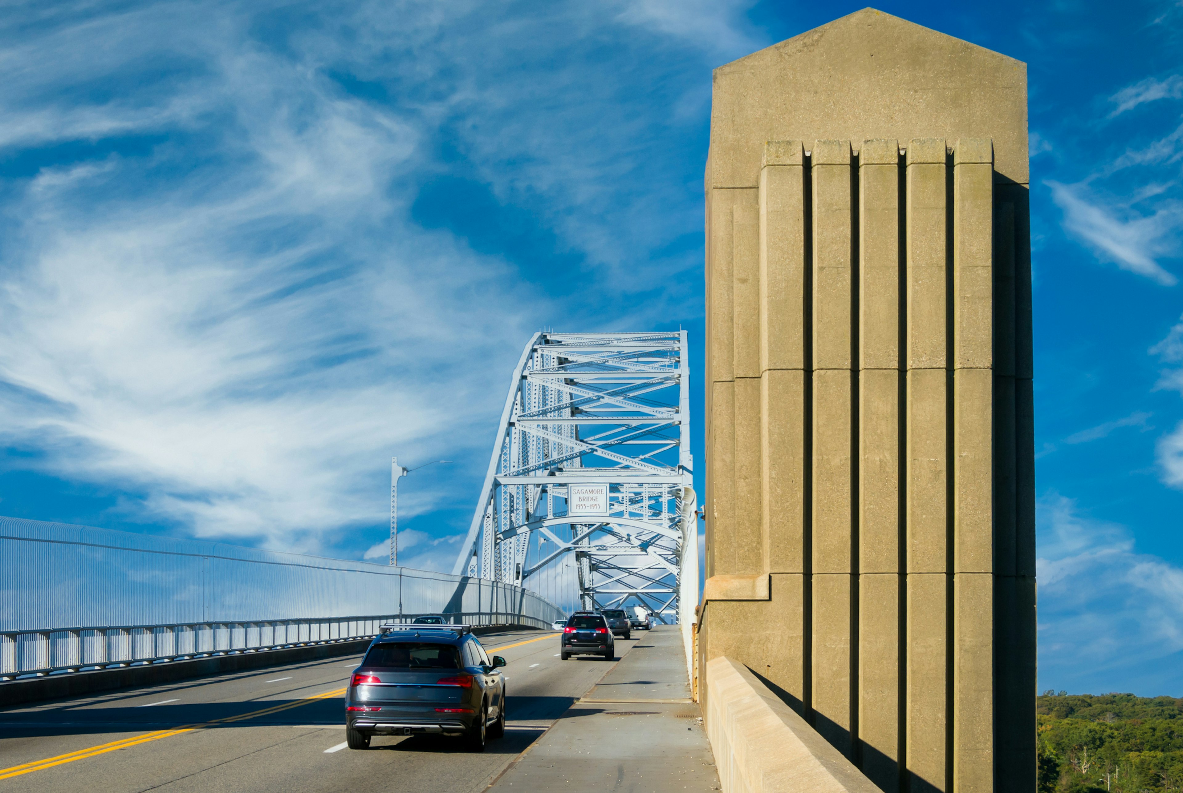 A steady stream of traffic crosses the Sagamore Bridge as it crosses the Cape Cod Canal leaving Cape Cod on a October afternoon.