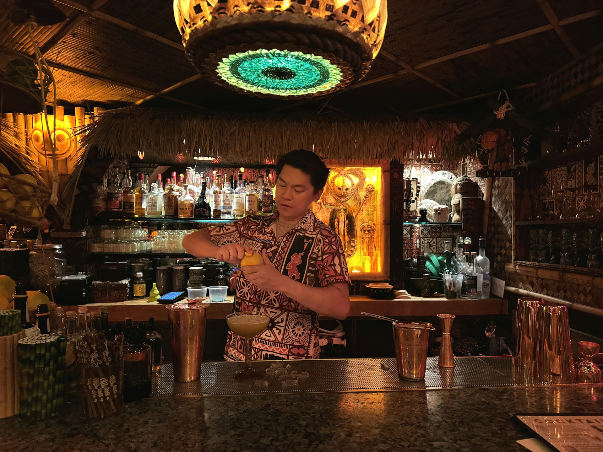 A bartender mixes a drink at The Lucky Tiki, a nod to the glory days of LA cocktail bars. 