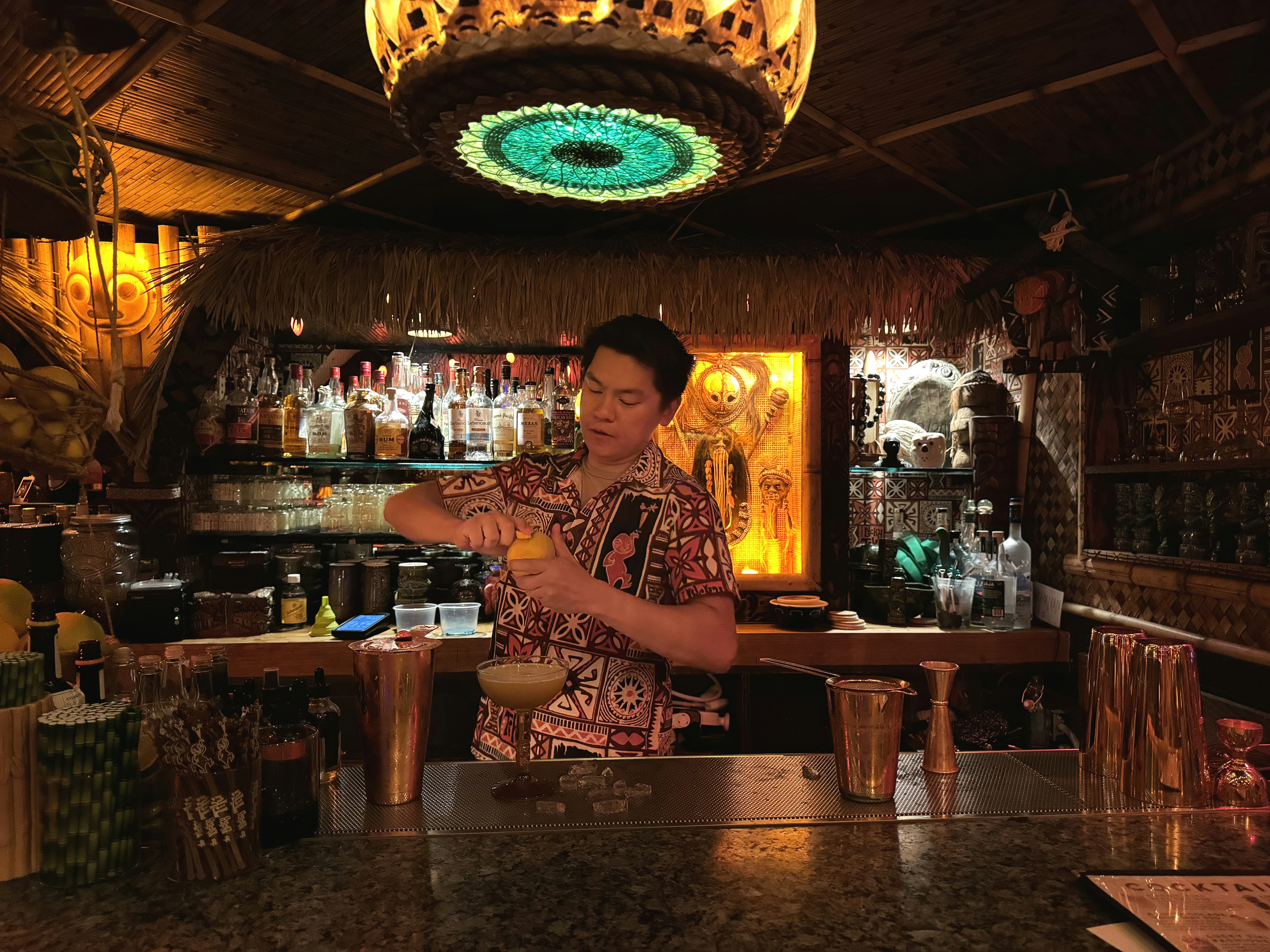 A bartender mixes a drink at The Lucky Tiki, a nod to the glory days of LA cocktail bars.