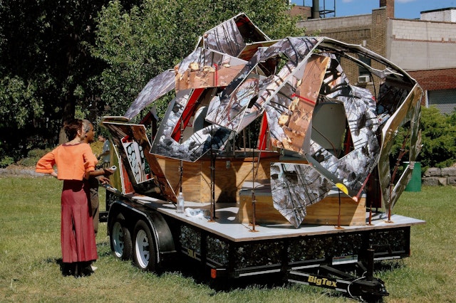 A couple views a contemporary art installation at Socrates Sculpture Park in Astoria, Queens, New York City, New York, USA