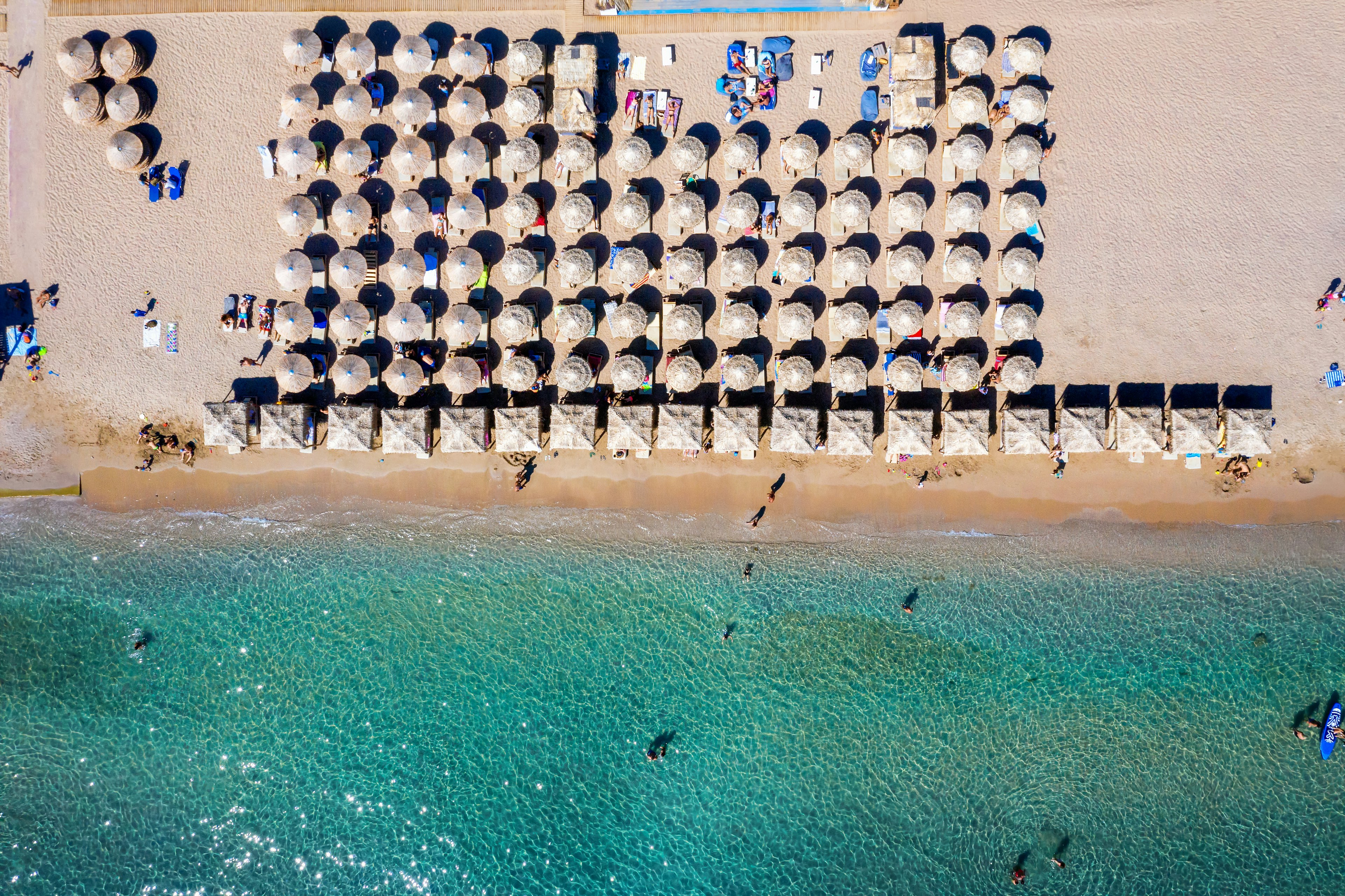 An overhead view of parasols and loungers on Varkiza Beach