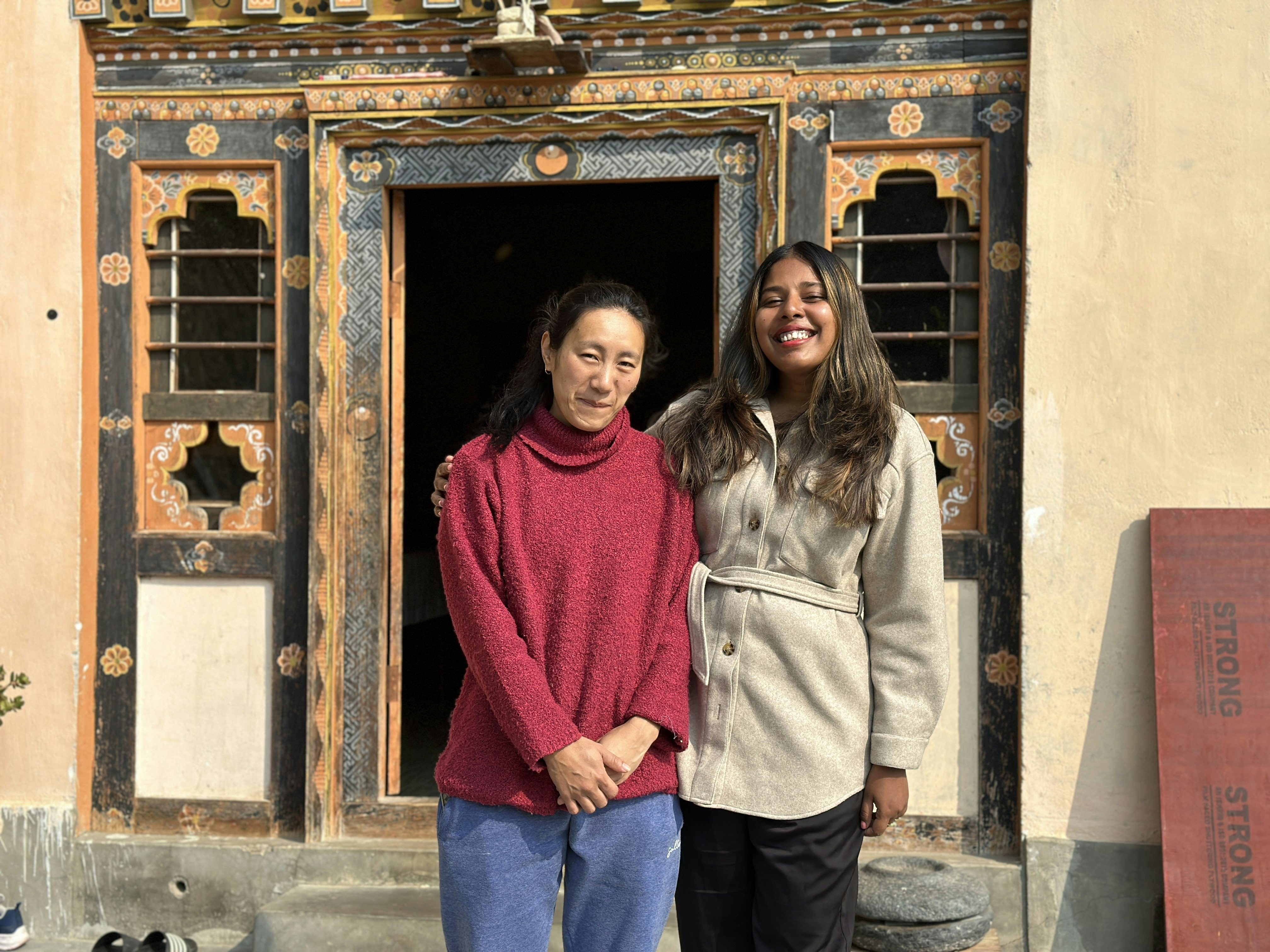 The writer with her homestay host in Bhutan