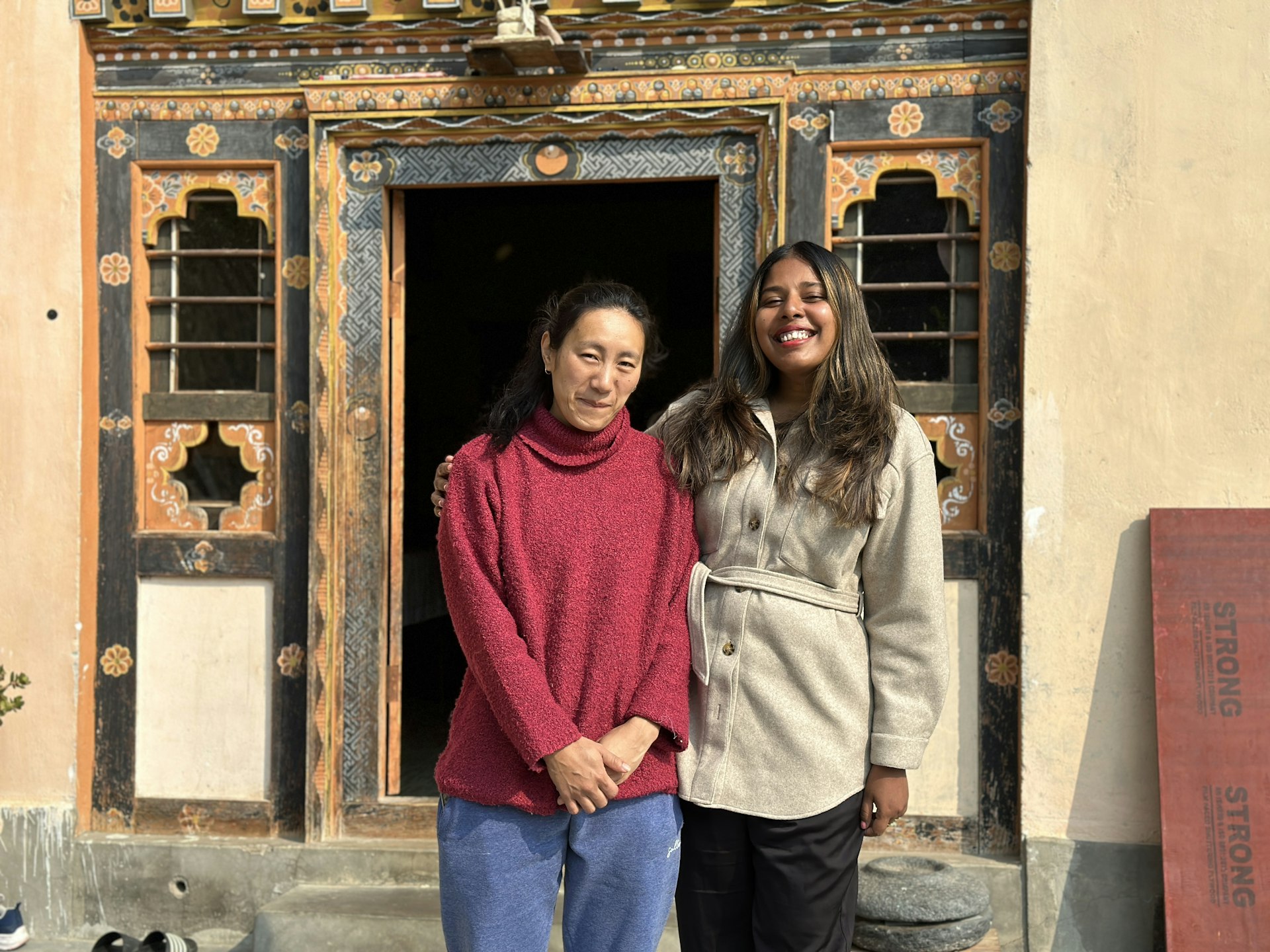 The writer with her homestay host in Bhutan