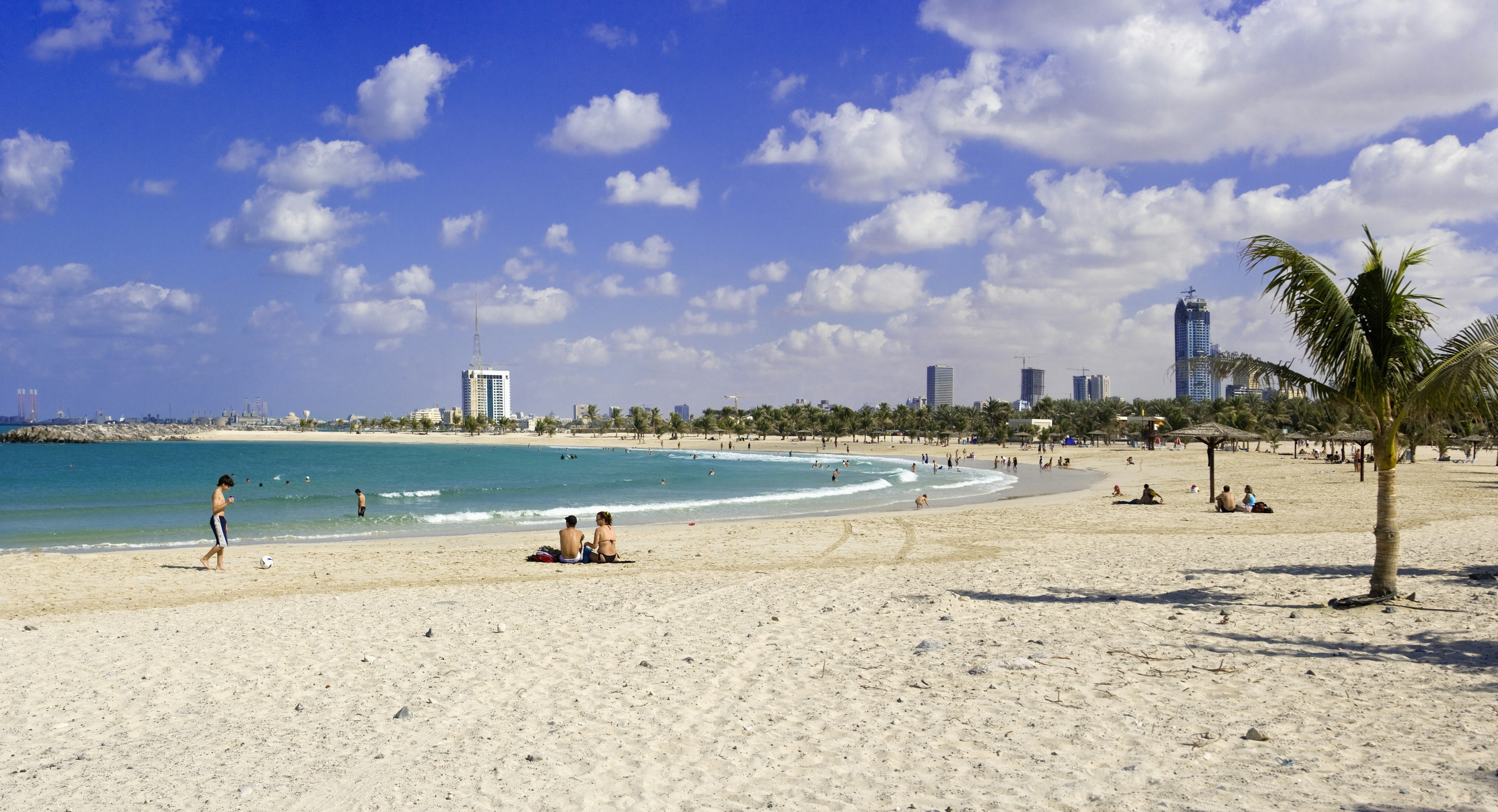 Visitors relaxing at Al Mamzar Beach Park in Dubai, United Arab Emirates