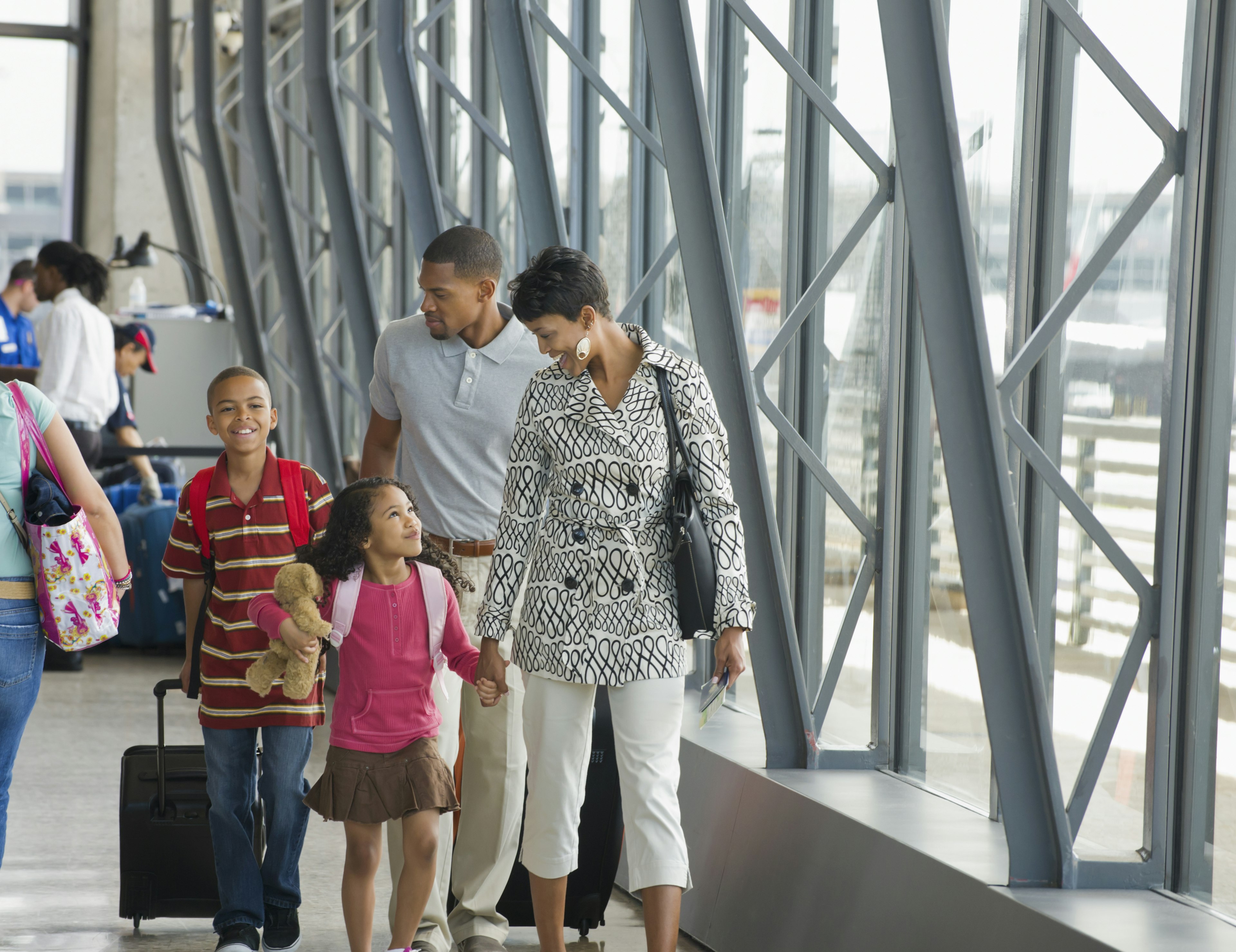 Family walking together in airport