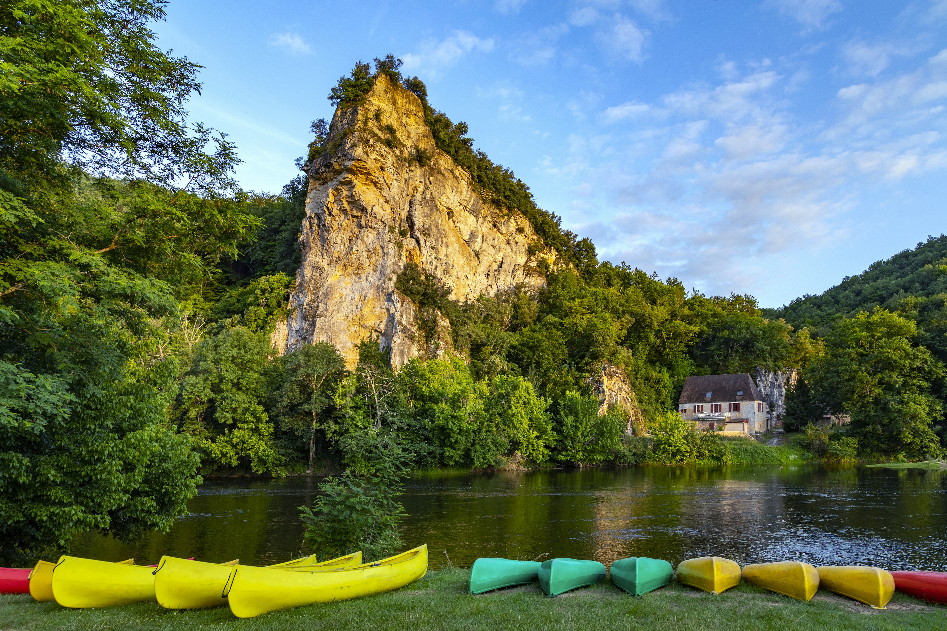 Late afternoon sunshine on the Dordogne River in the Nouvelle-Aquitaine region, France