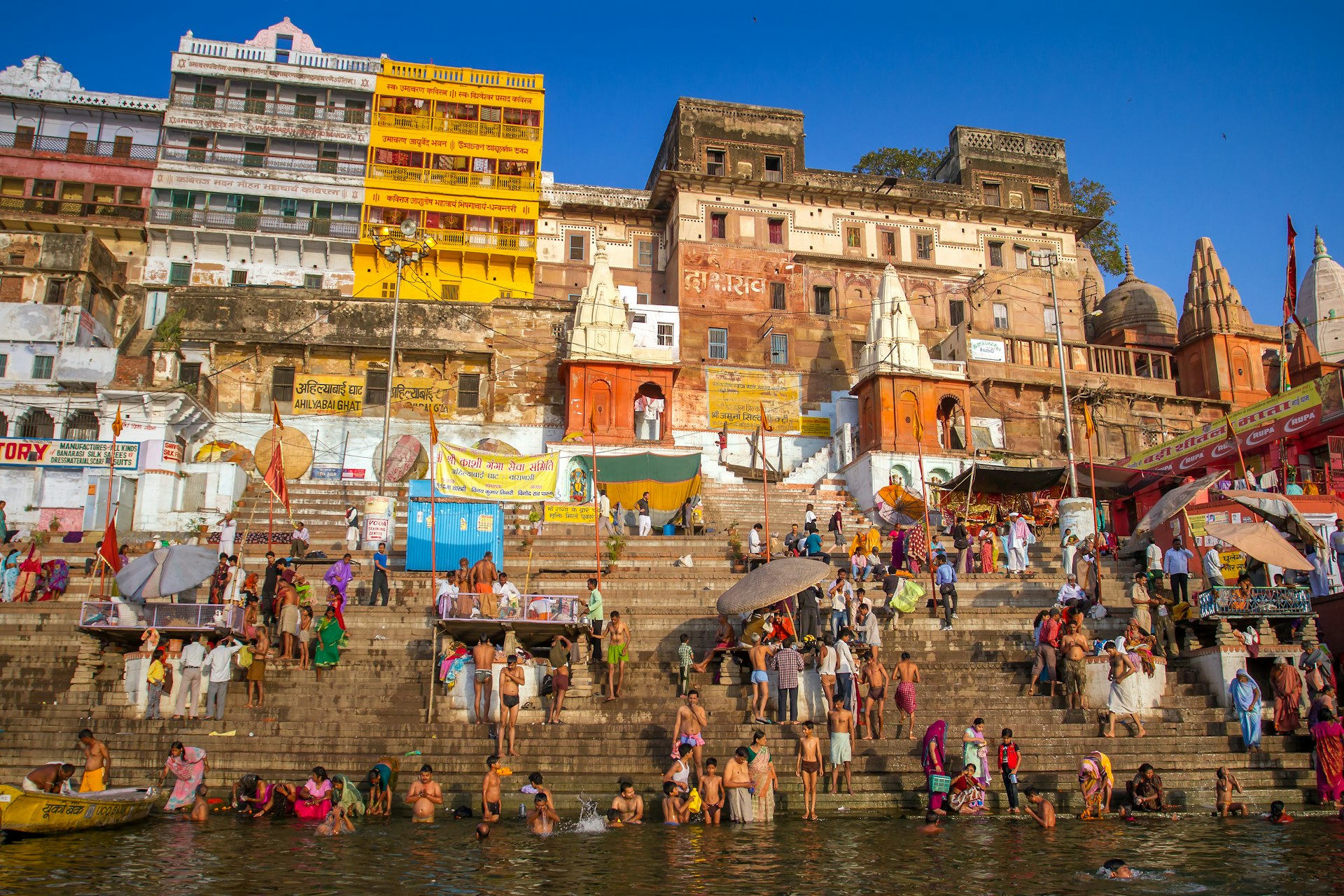 Hindu pilgrims take holy bath in the river ganges on the auspicious Maha Shivaratri festival at Dasashwamedh ghat in Varanasi, Uttar Pradesh, India.