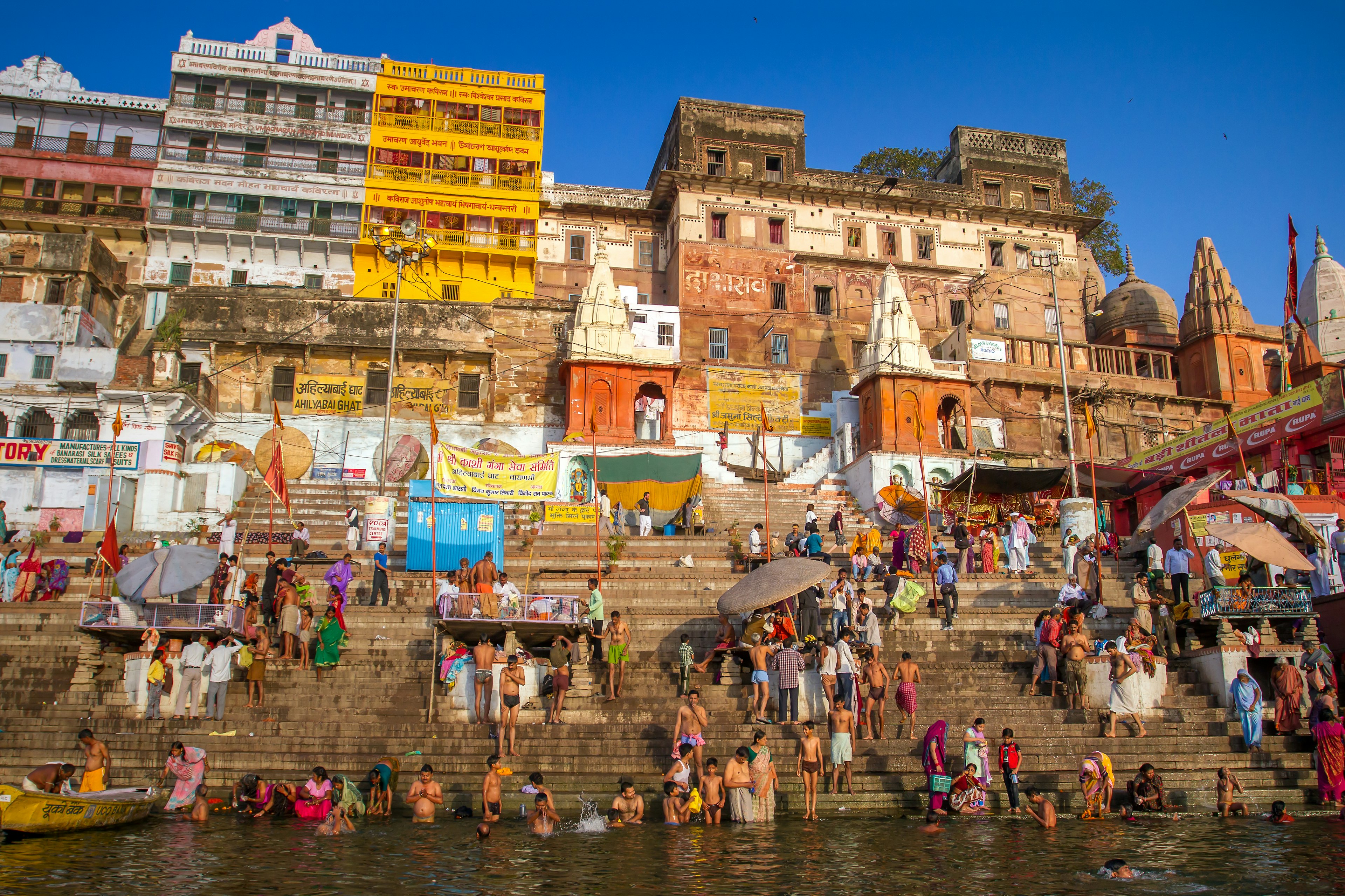 Hindu pilgrims take holy bath in the river ganges on the auspicious Maha Shivaratri festival at Dasashwamedh ghat in Varanasi, Uttar Pradesh, India.