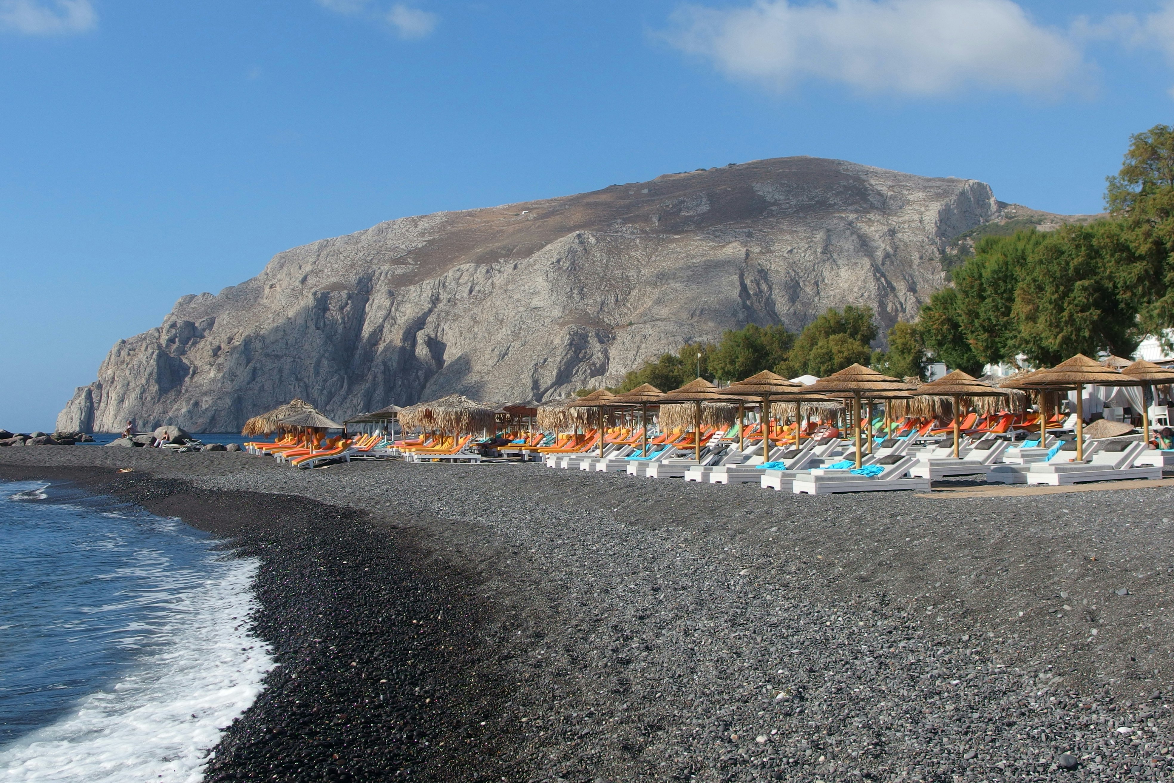 beach in Kamari on bright summer day, Santorini island, Greece