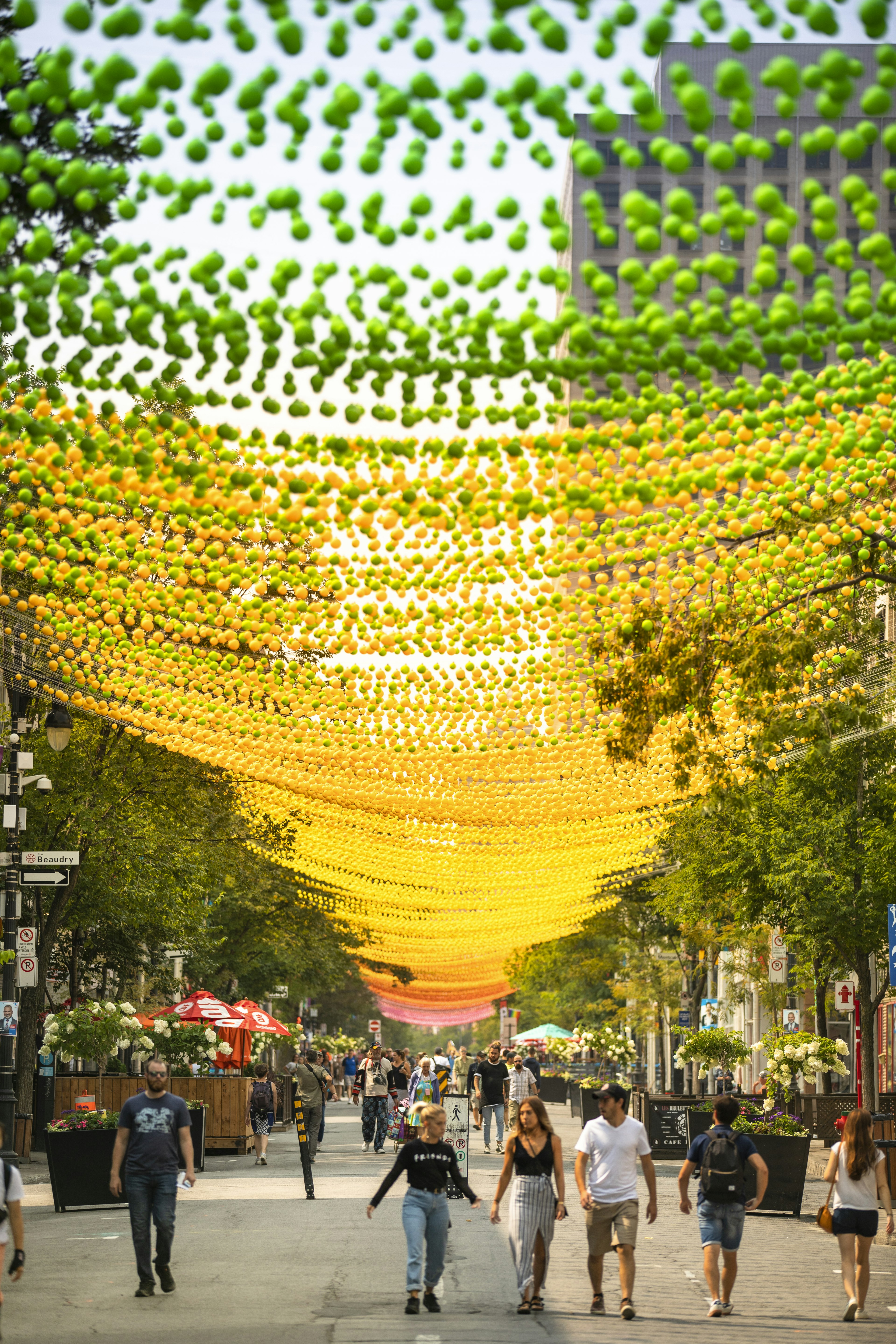 People walk along Montreal Gay Village in Summer