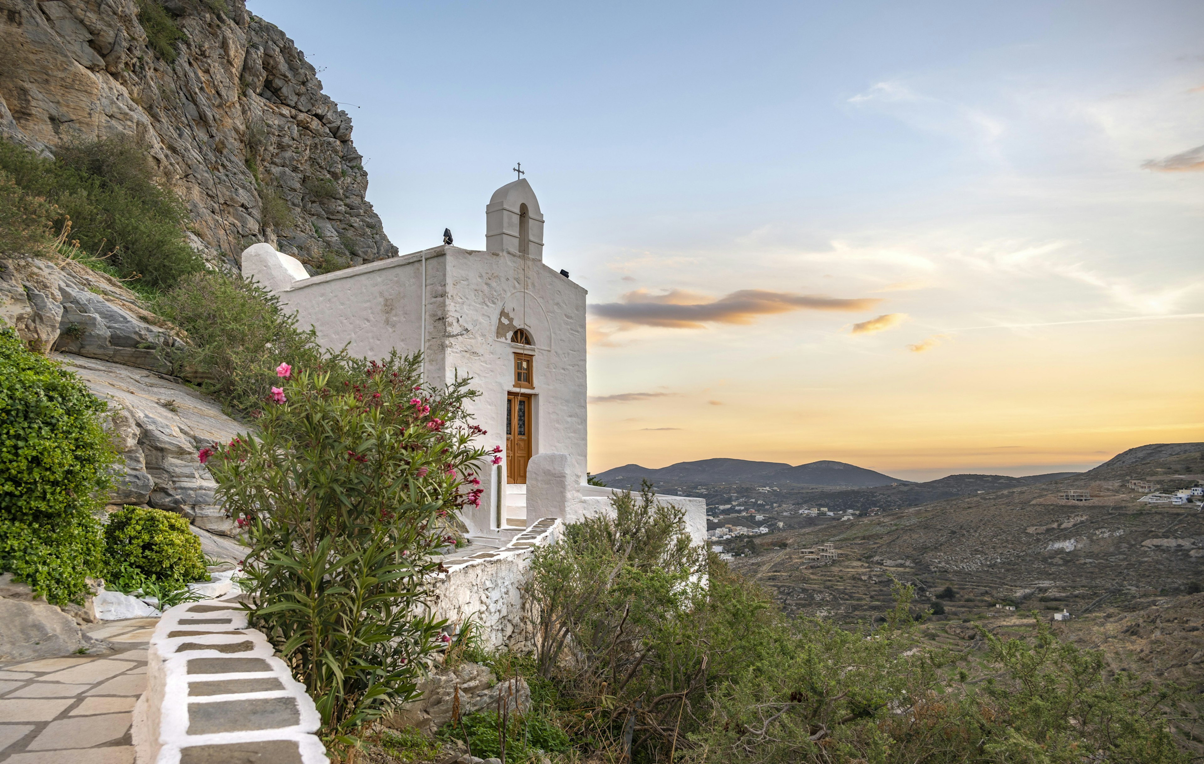 A Greek Orthodox Chapel at sunset on Ano Syros, Syros, Cyclades, Greece