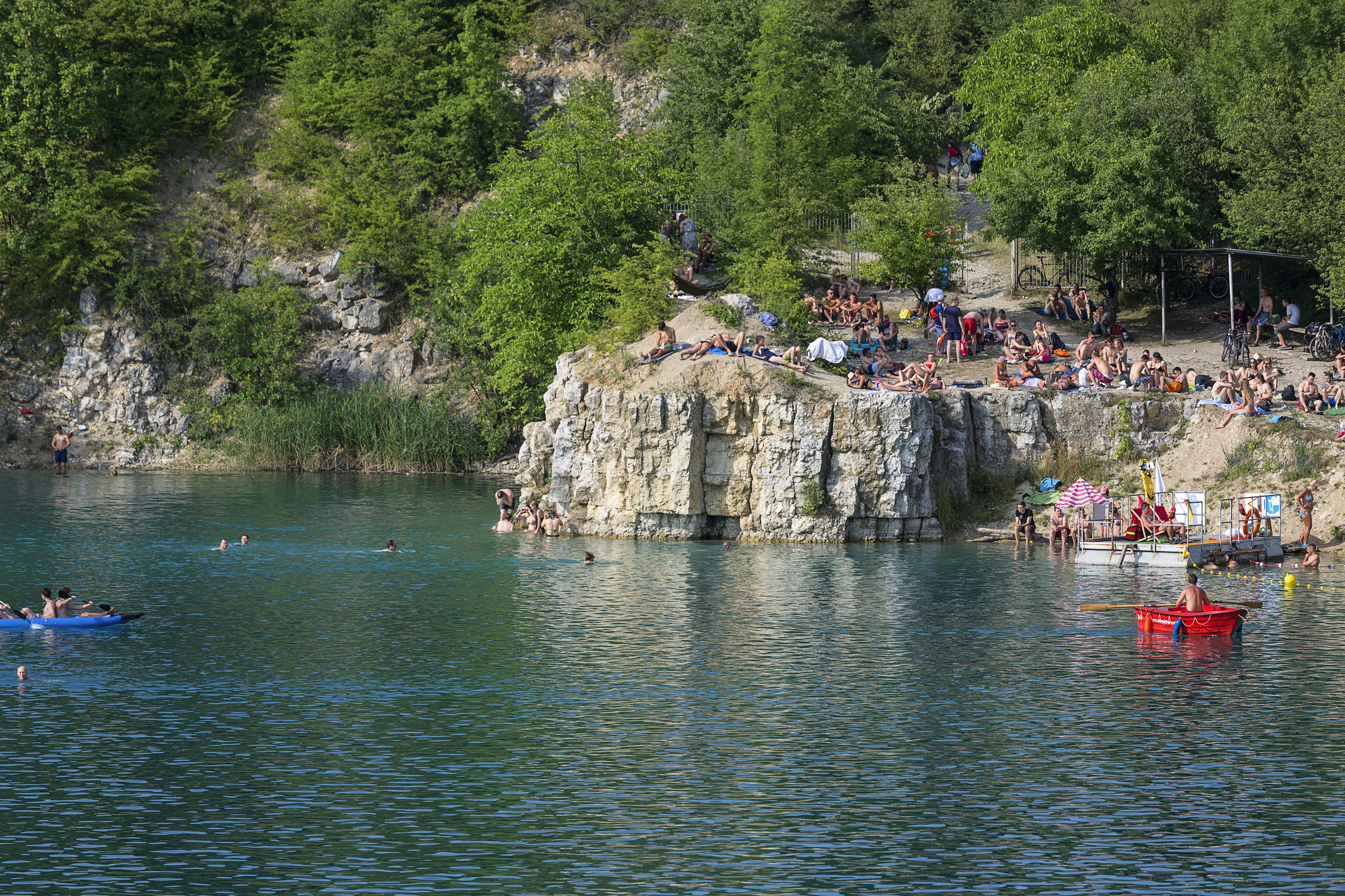 Lagoon Zakrzowek in an old limestone quarry, emerald water, resting people