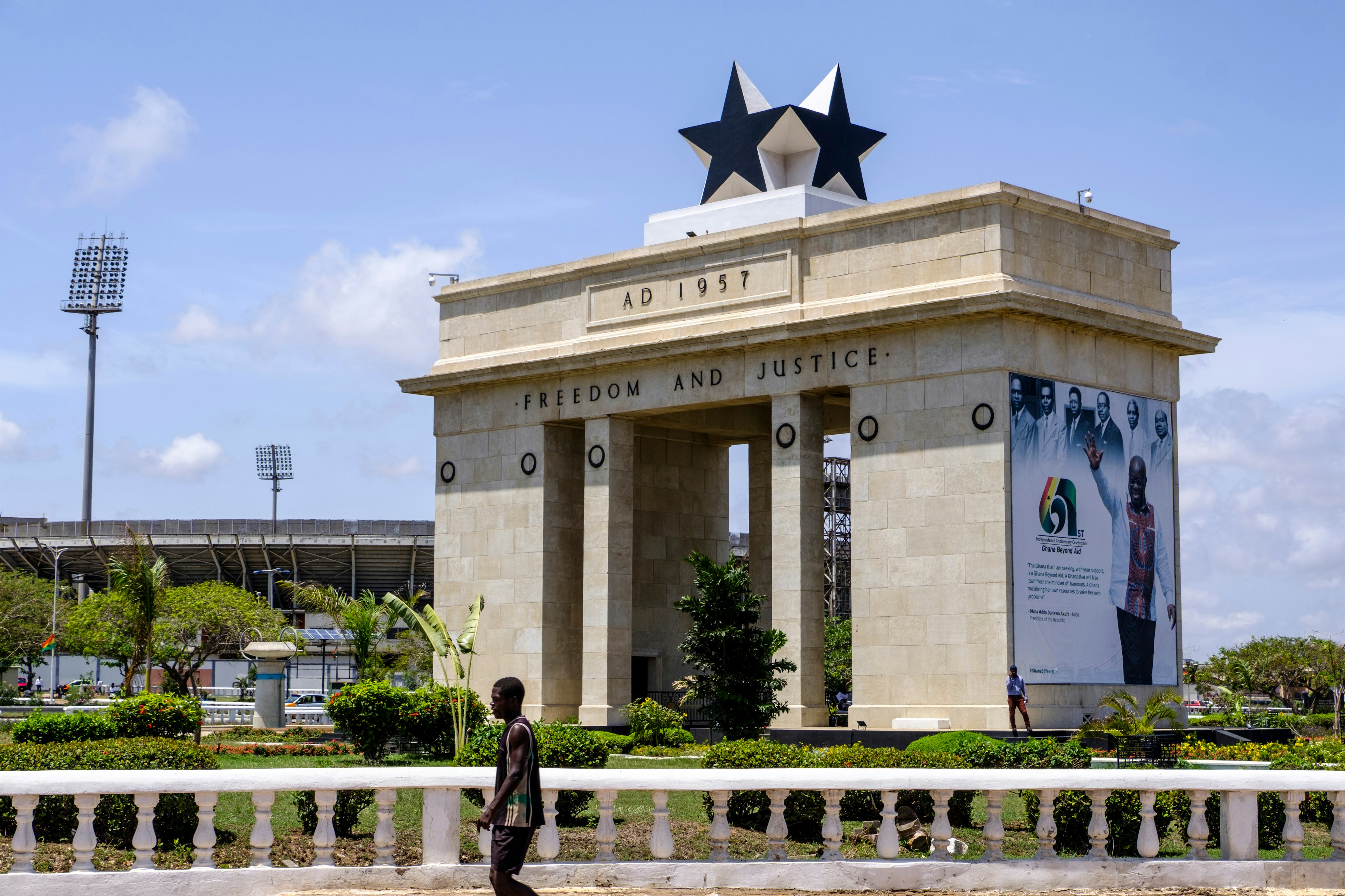 A man walks past the arch of Black Star Gate, symbol of freedom and part of Independence Square in Accra, Ghana, West Africa