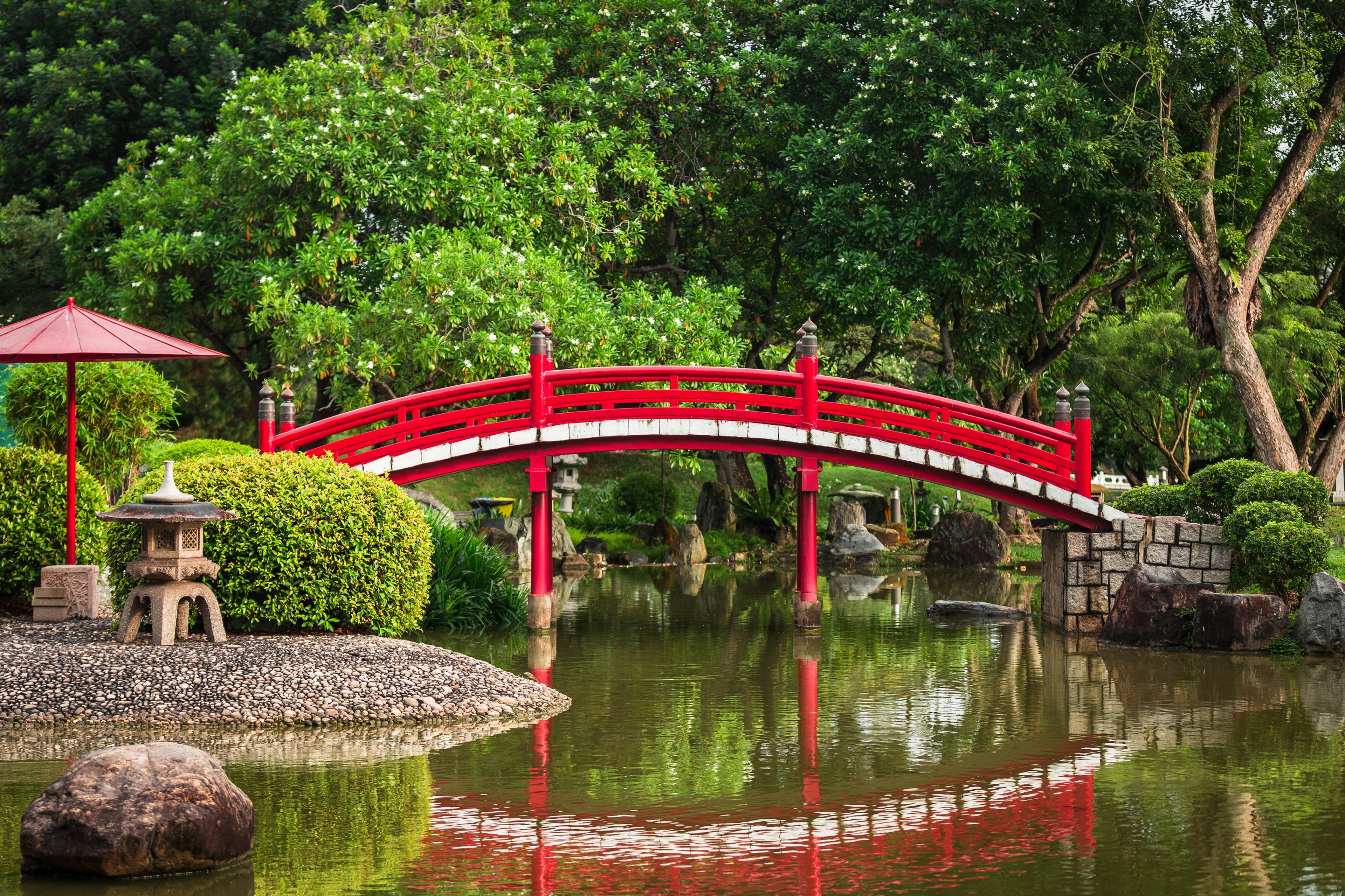 A red wooden bridge at the Japanese Garden inside the Chinese Garden in Jurong East, Singapore