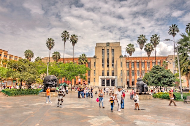 People walking around Medellin's historical center in sunny weather
