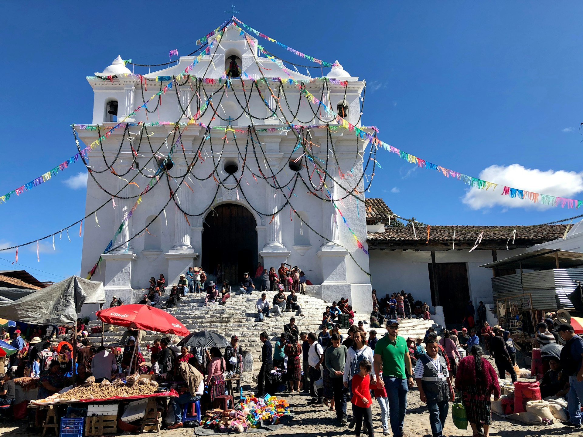 Locals gather on the steps of the basilica in Chichicastenango during the festival of Saint Thomas.