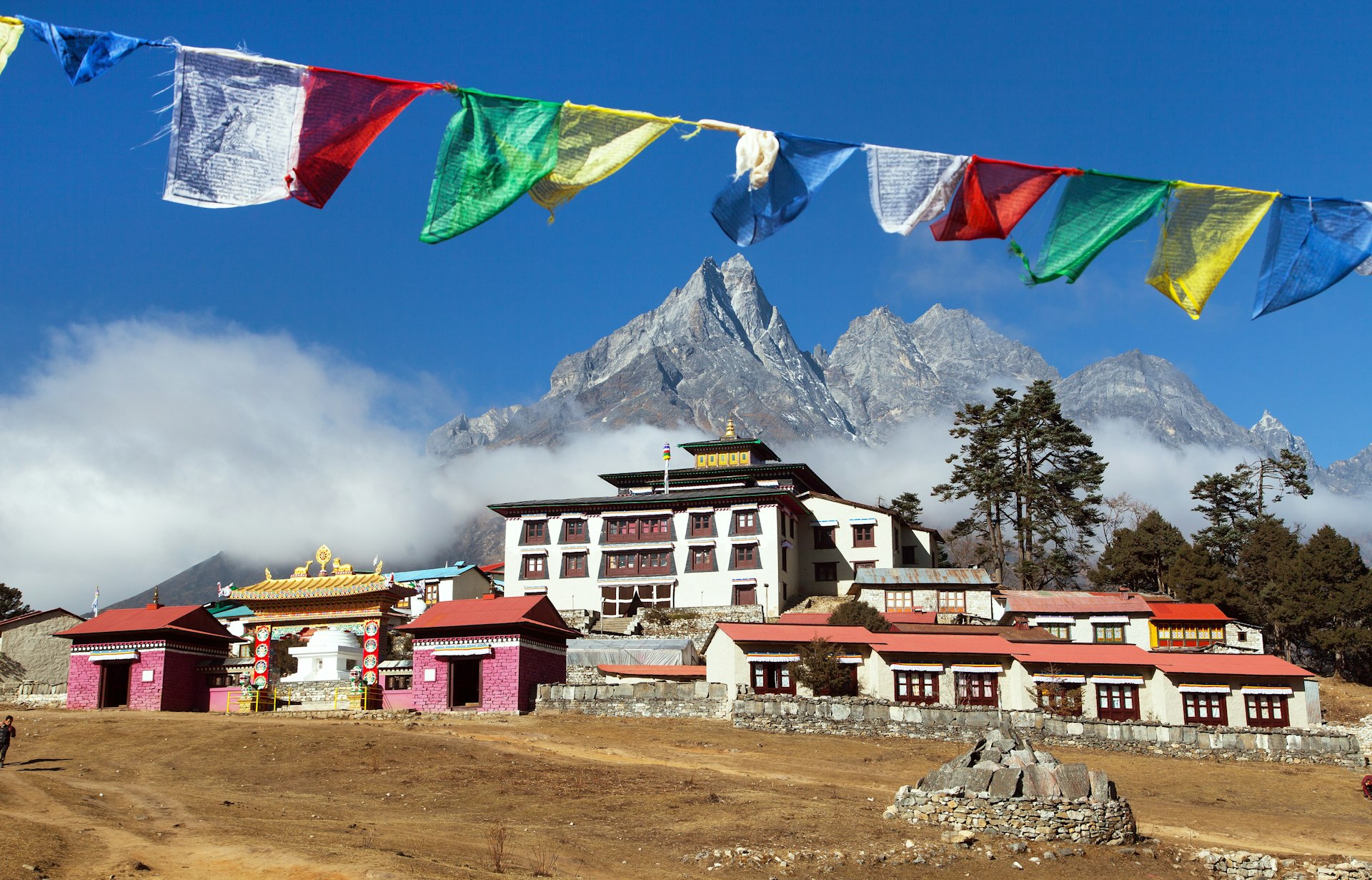 Prayer flags flutter over Tengboche monastery, Everest region, Nepal.