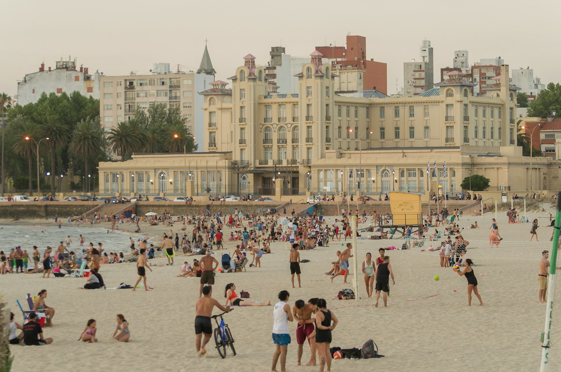 Beautiful sunset on Ramyres beach with bathers on a summer day in Montevideo Uruguay