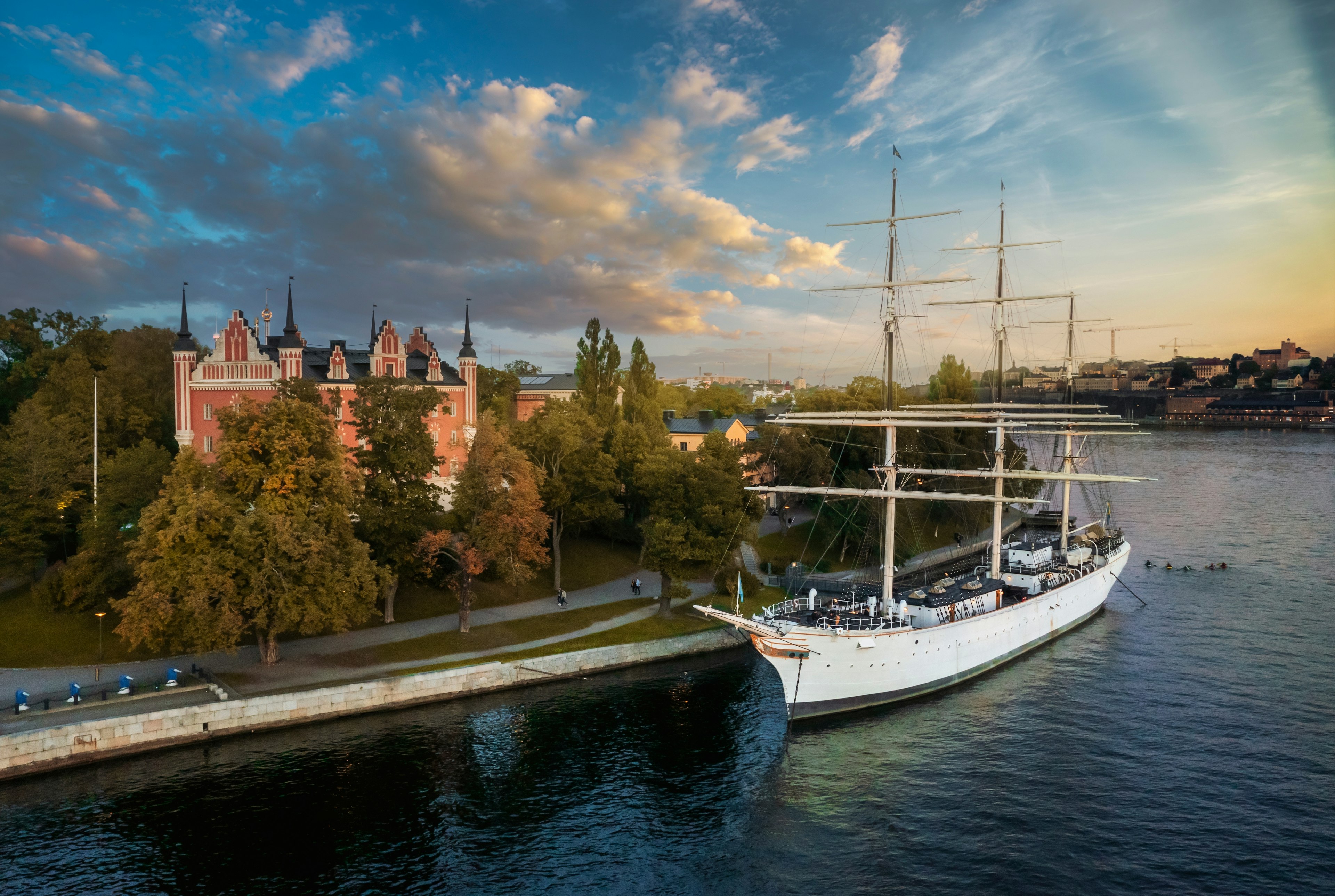 The full-rigged sailing ship af Chapman moored on the quay of Skeppsholmen, seen at sunset in Stockholm