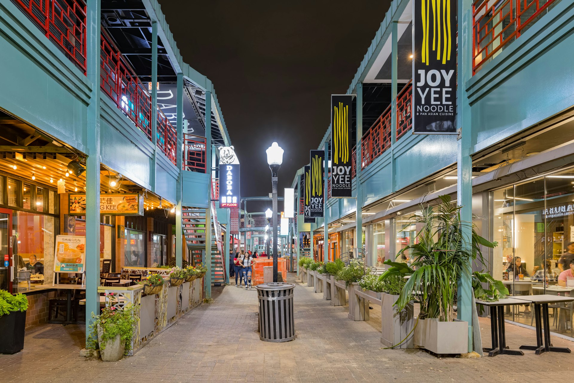 A narrow lane of restaurants spread over two floors in Chinatown, Chicago.