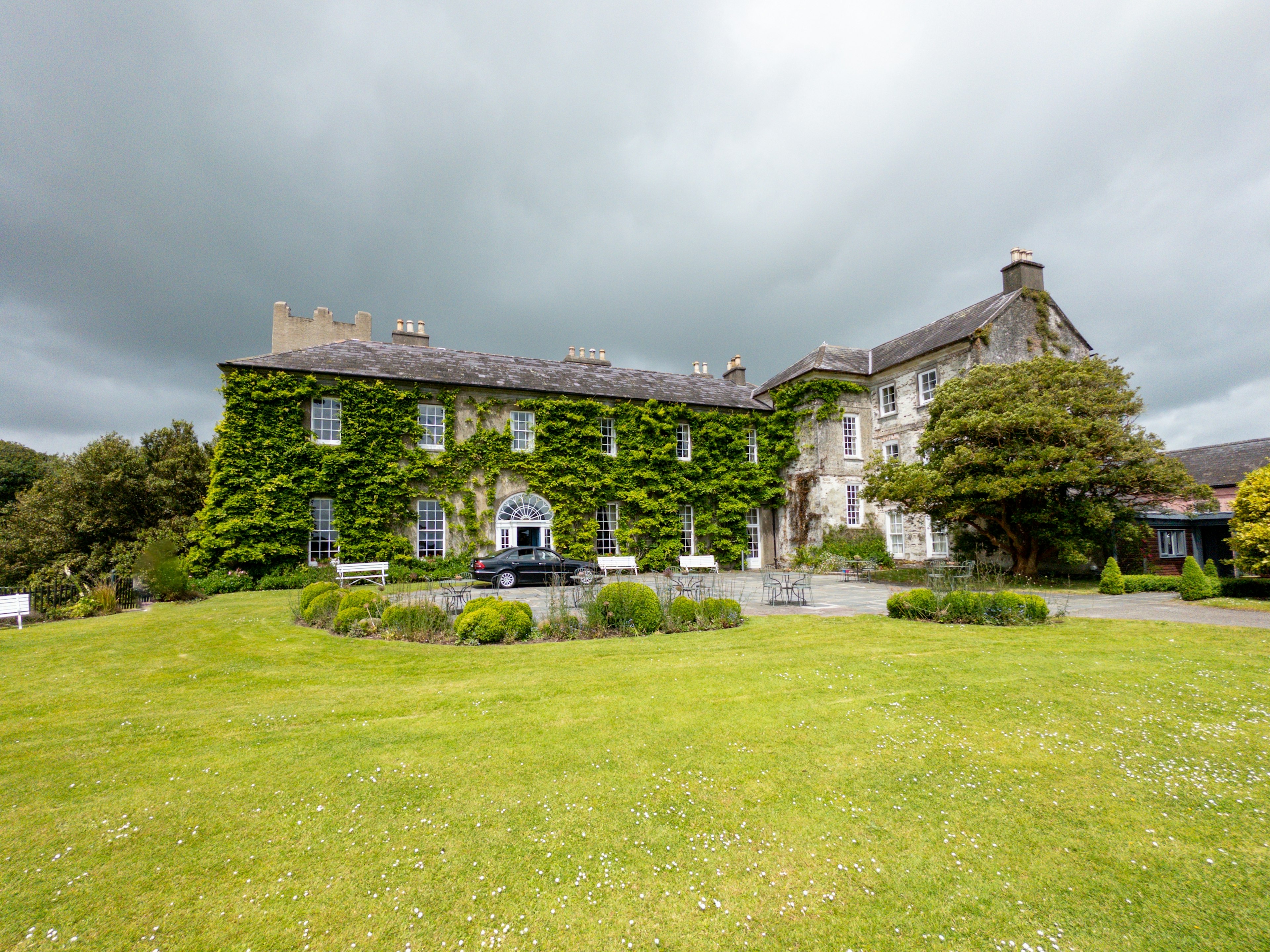 The ivy-covered exterior of Ballymaloe House Hotel, a luxury hotel and cooking school in Cork, Ireland