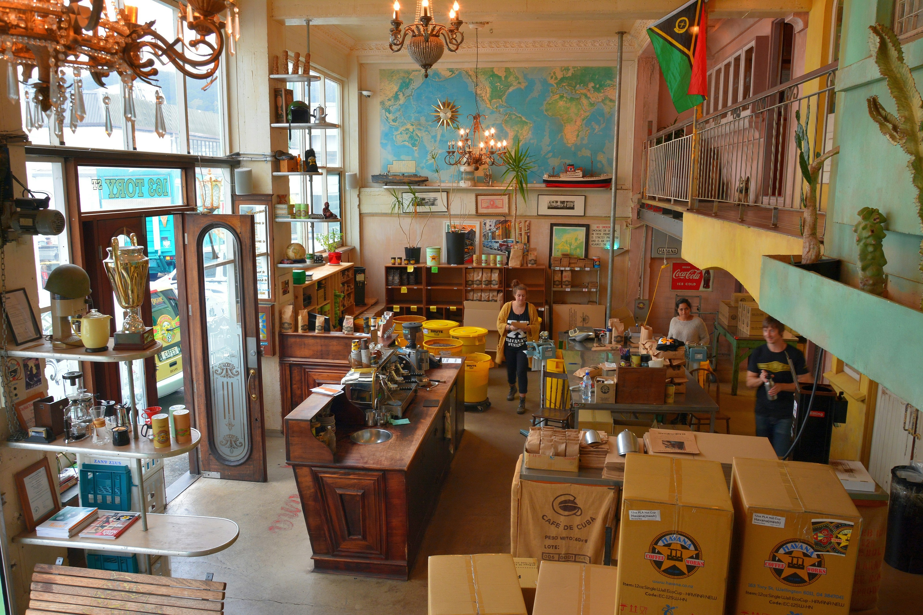 Interior view of Havana Coffee Works in Wellington, NZ, with furniture and people.,