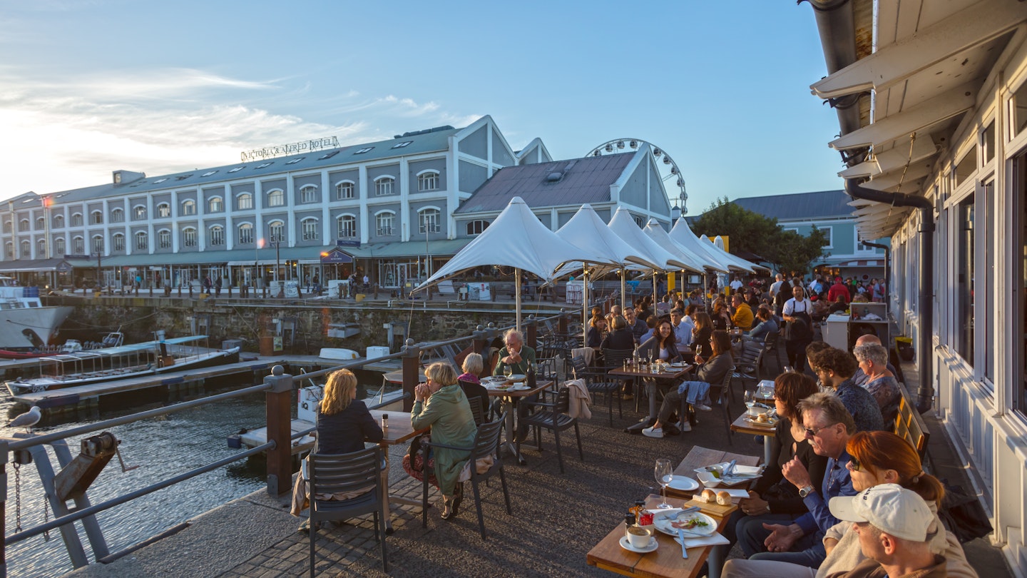 People Enjoying Beautiful Sunset in Restaurant. Waterfront -Cape Town ,South Africa 11-11-2017, License Type: media, Download Time: 2024-08-30T14:45:46.000Z, User: bfreeman_lonelyplanet, Editorial: true, purchase_order: 65050, job: Online Editorial, client: Things to know South Africa, other: Bailey Freeman