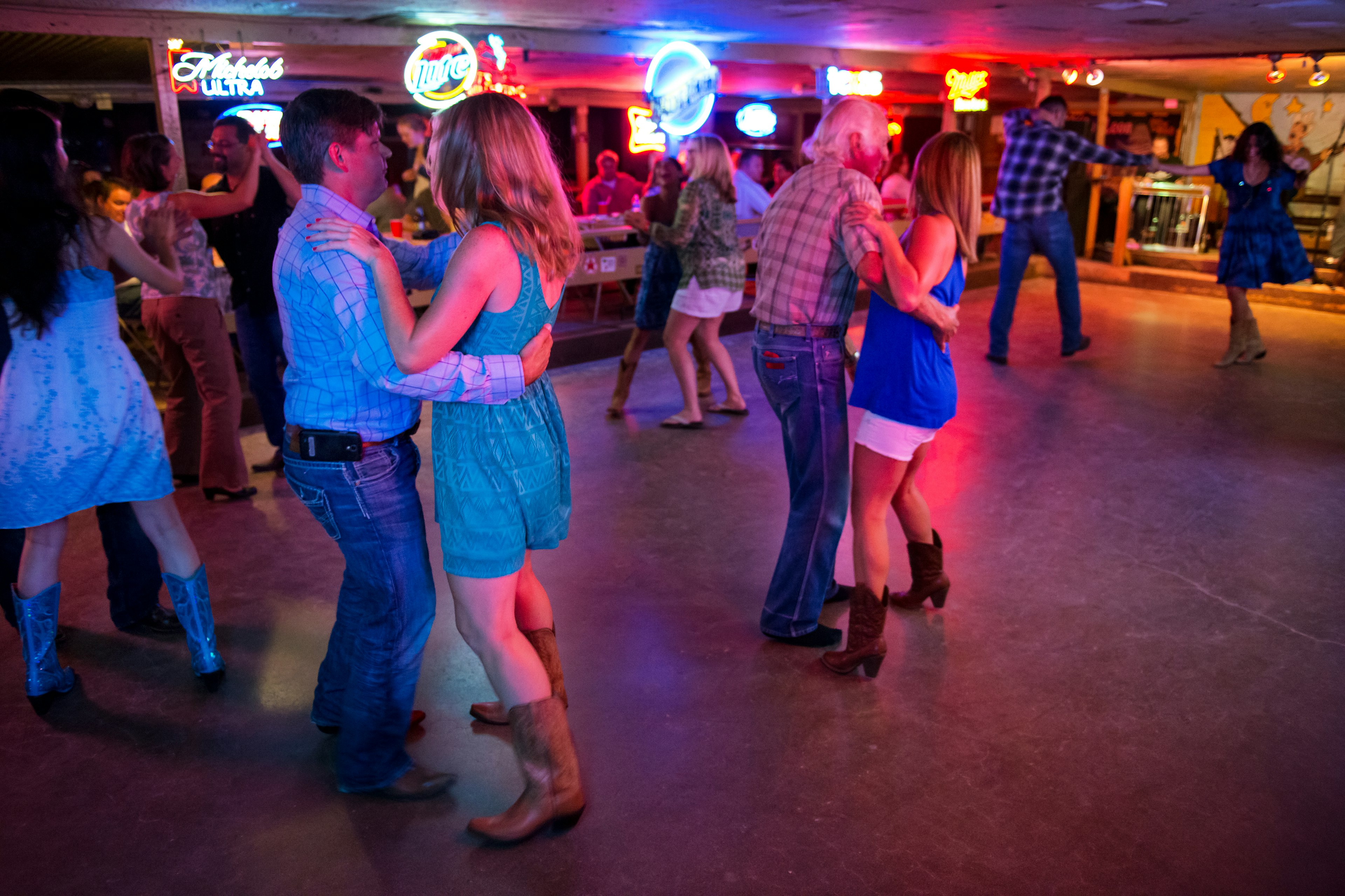 People dancing country music in the Broken Spoke dance hall in Austin, Texas, USA