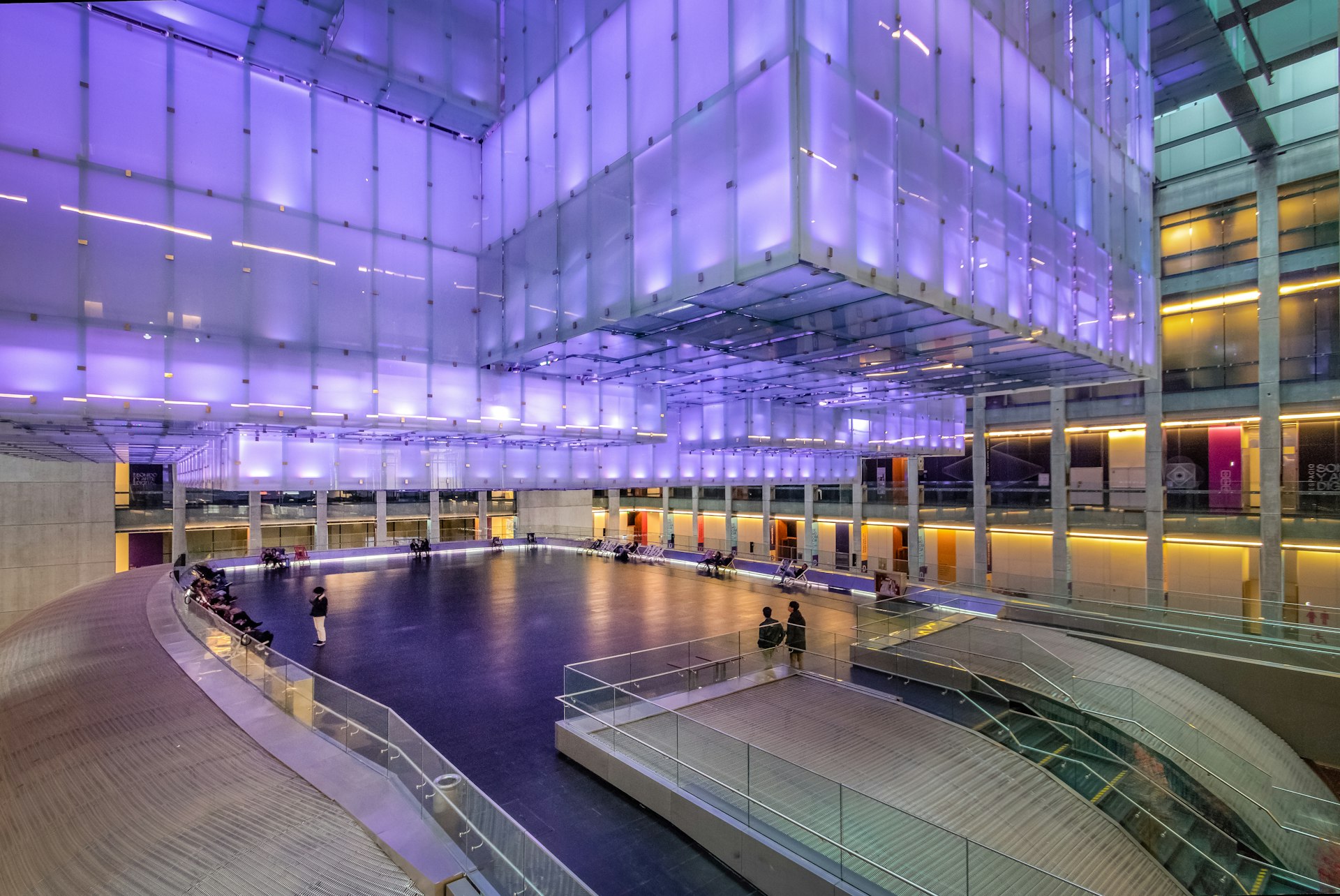 Interior of the Kirchner Cultural Centre (Centro Cultural Kirchner or CCK) in Buenos Aires, Argentina, lit by purple light. 