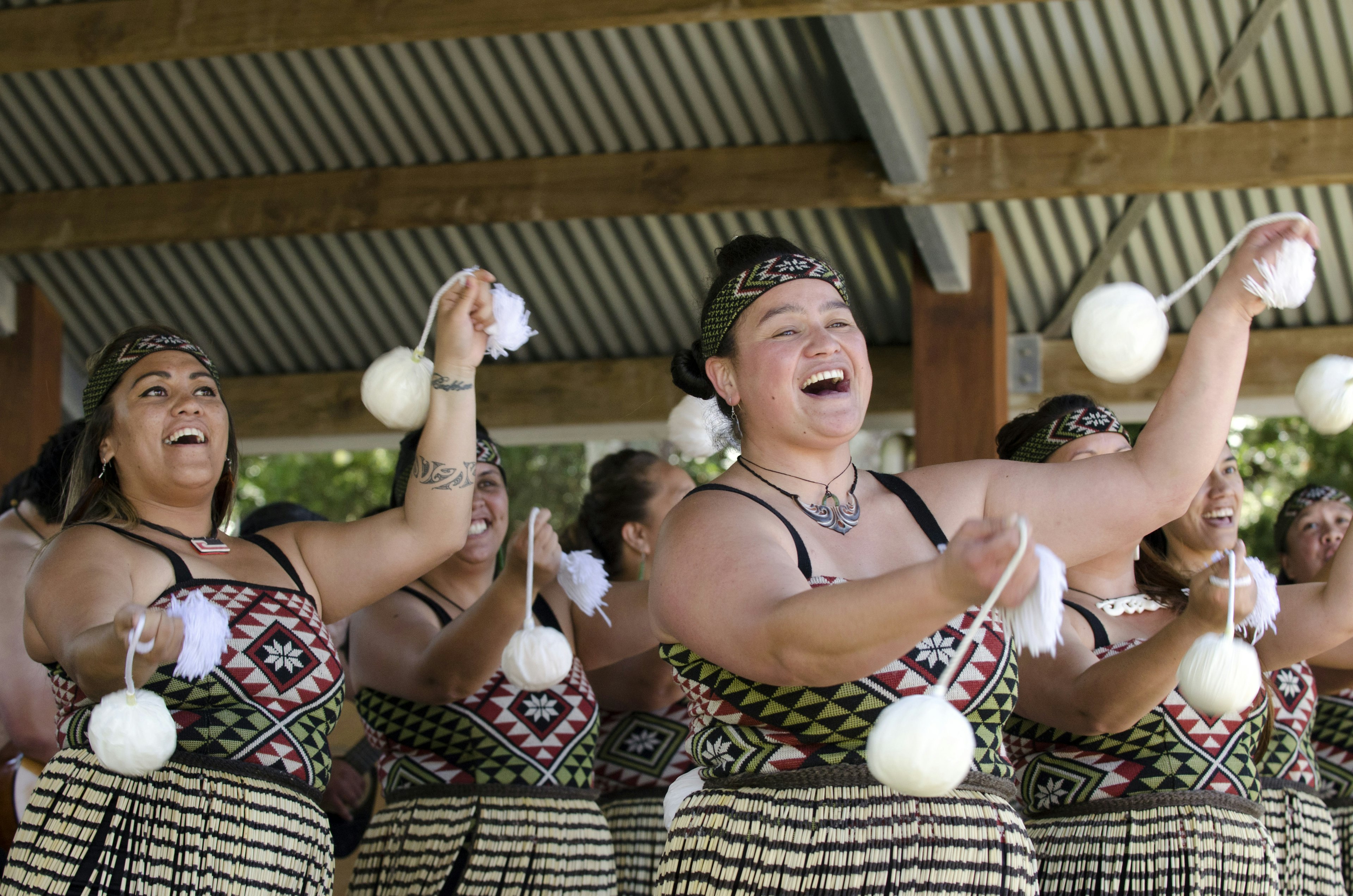 Maori women perform poi-dance during Waitangi Day in NZ