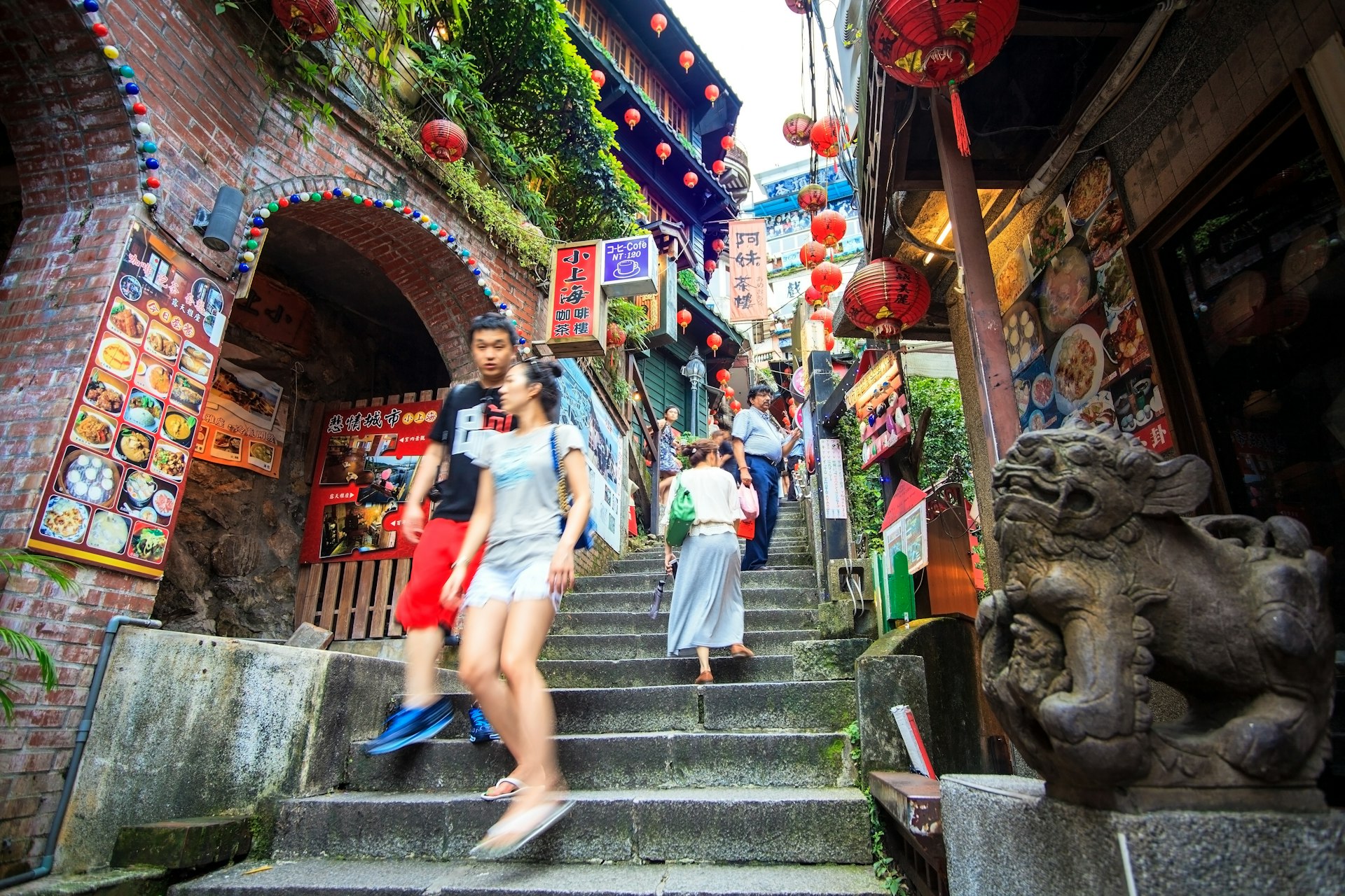 Pedestrians on stairs at the seaside mountain town of Jiufen.