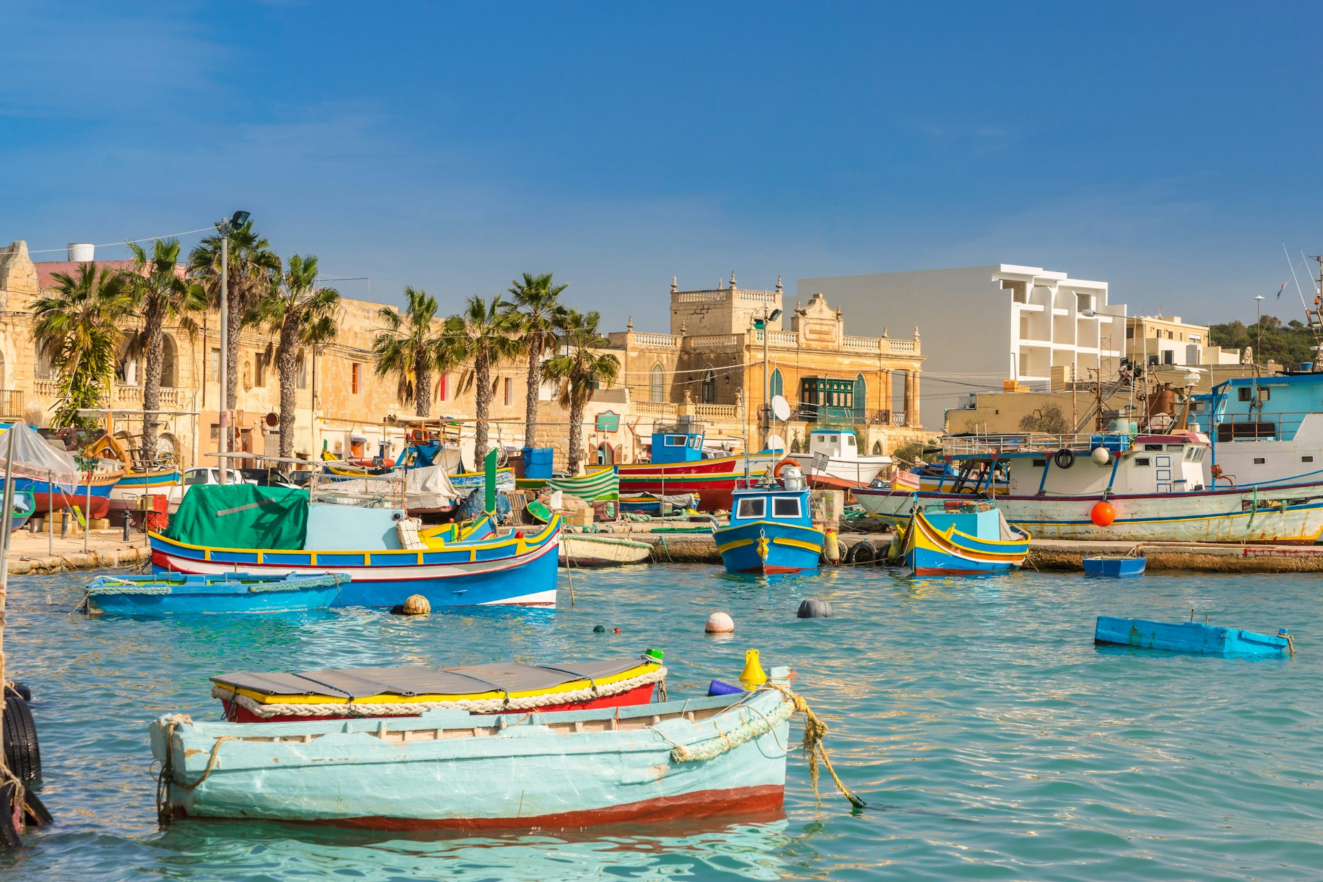 Colorful luzzu boats in the harbor of Marsaxlokk, Malta