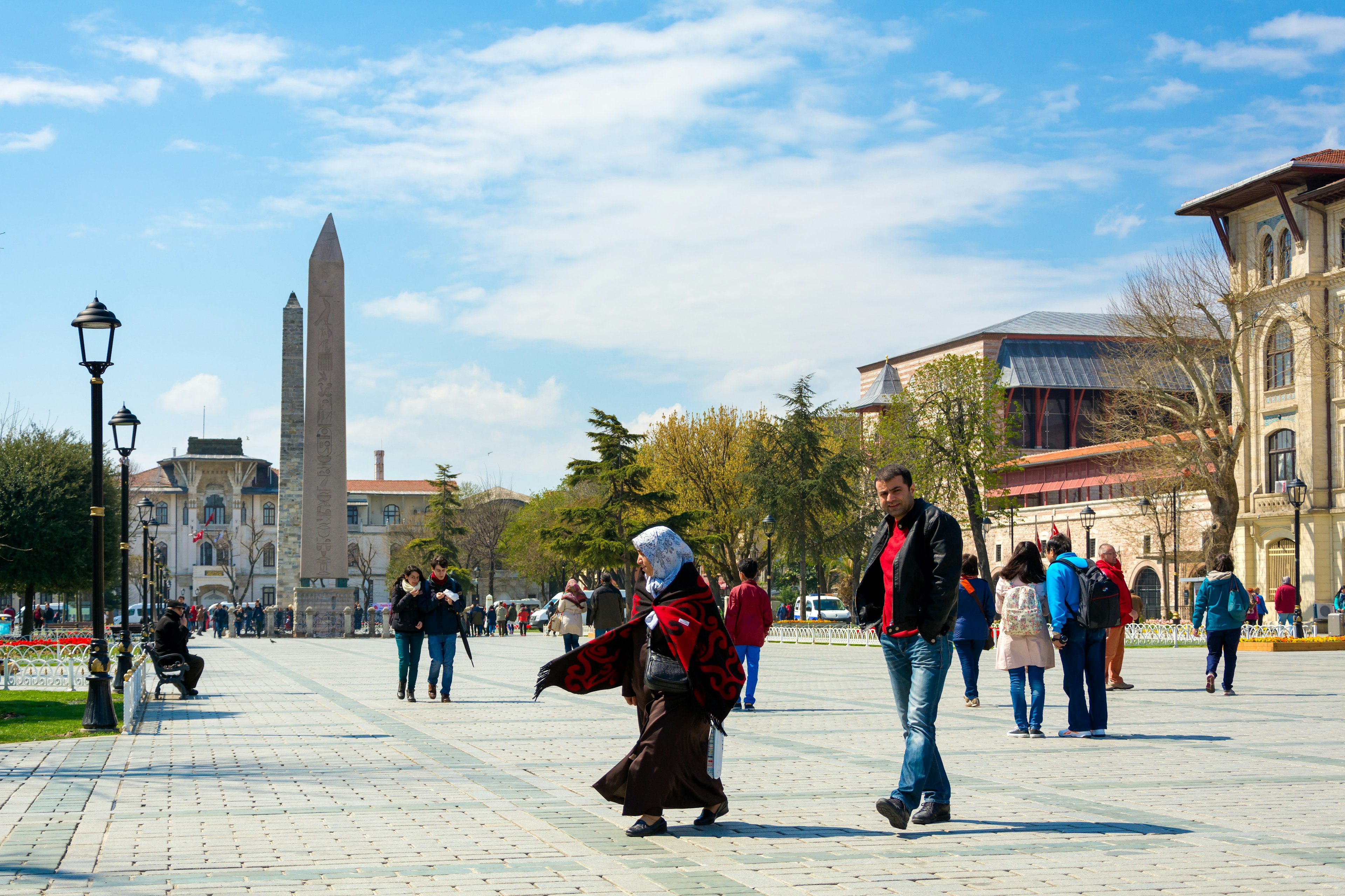 People walking in Sultan Ahmet Square near the Obelisk of Theodosius