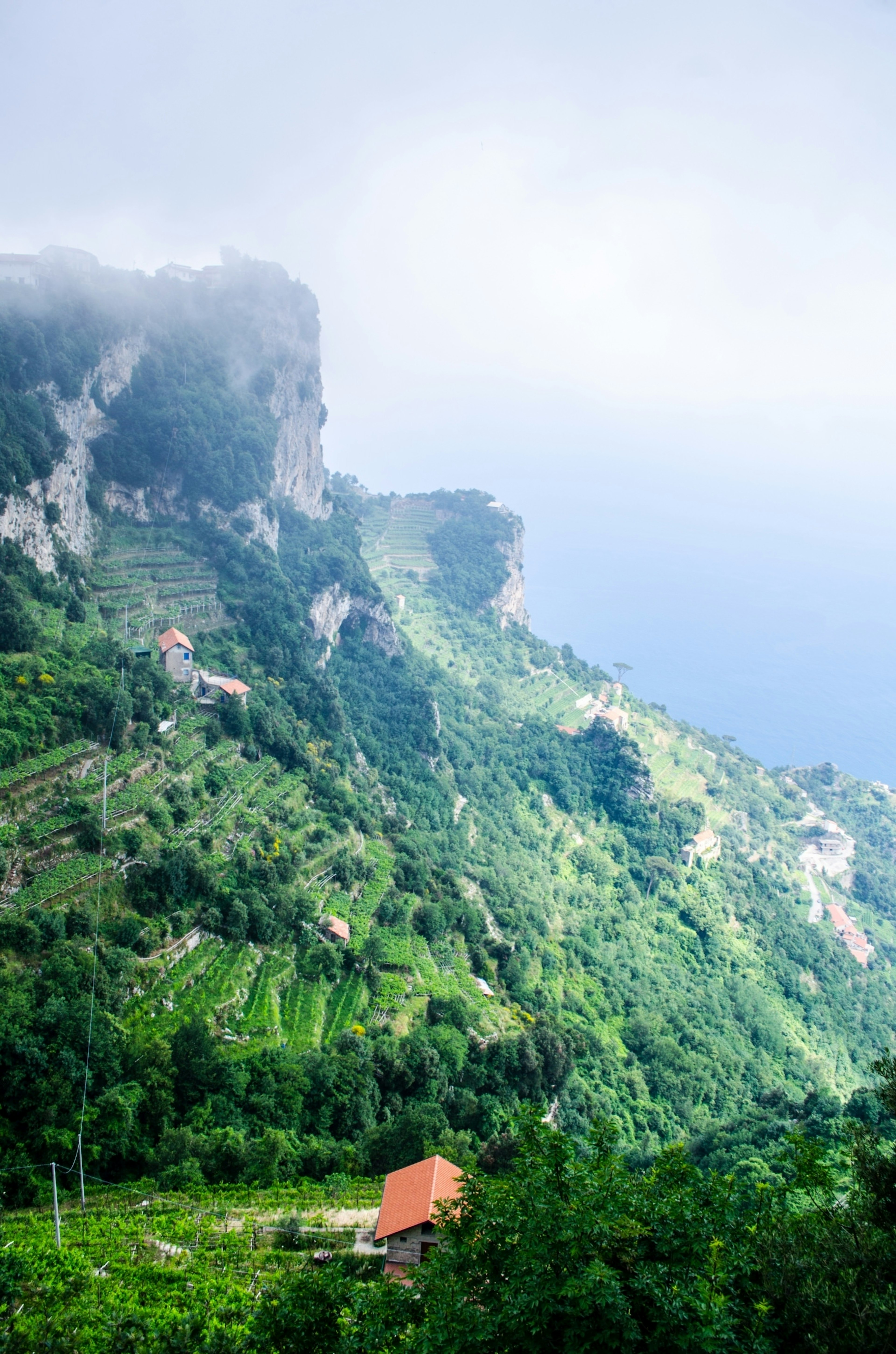 A picture taken on a seaside trail in Campania during a foggy day