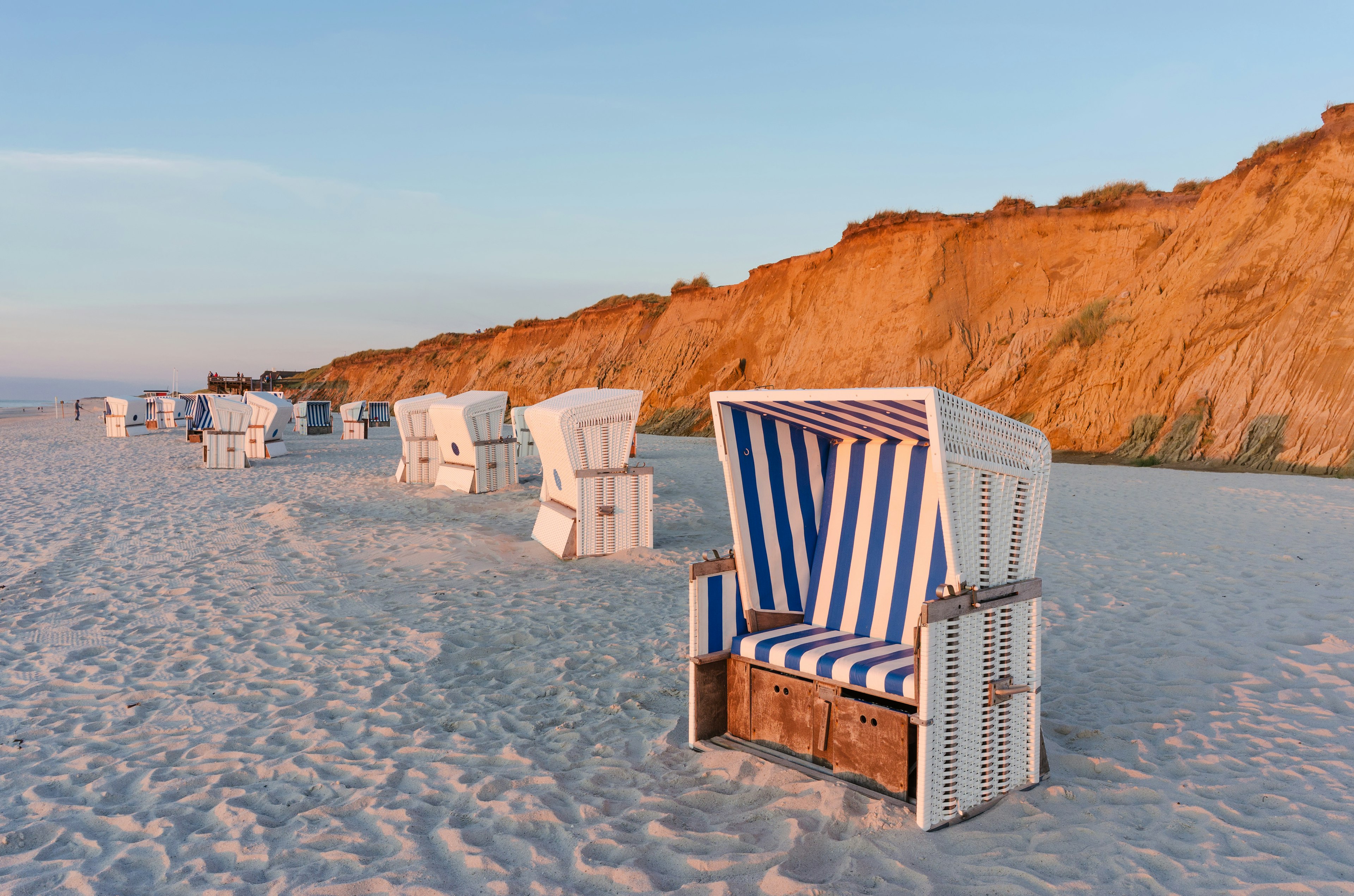 Beach chairs with Red Cliff near Kampen on the island of Sylt, Schleswig-Holstein, Germany