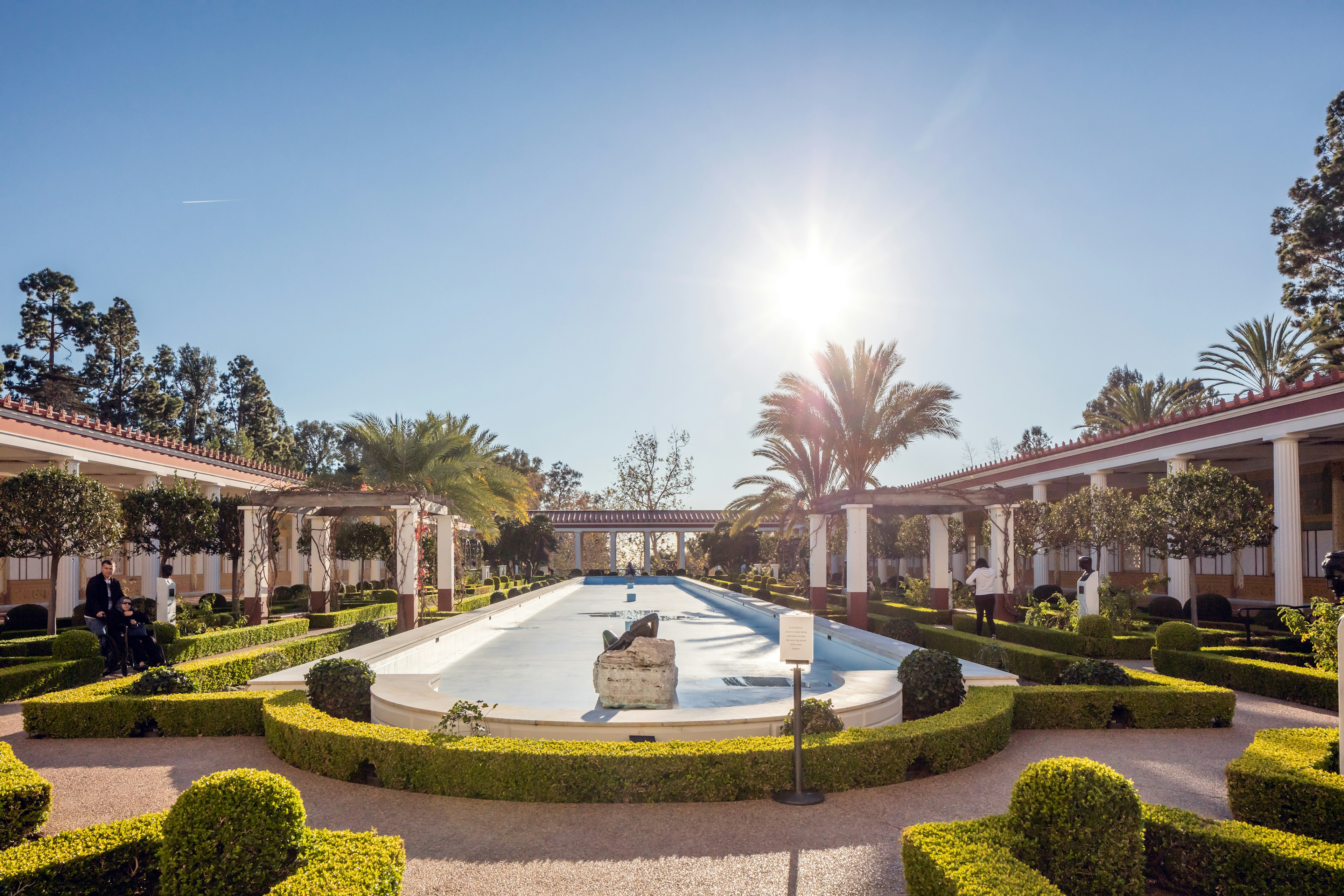 A reflecting pool and manicured gardens at the Getty Villa, which recreates the layout of an ancient Roman abode