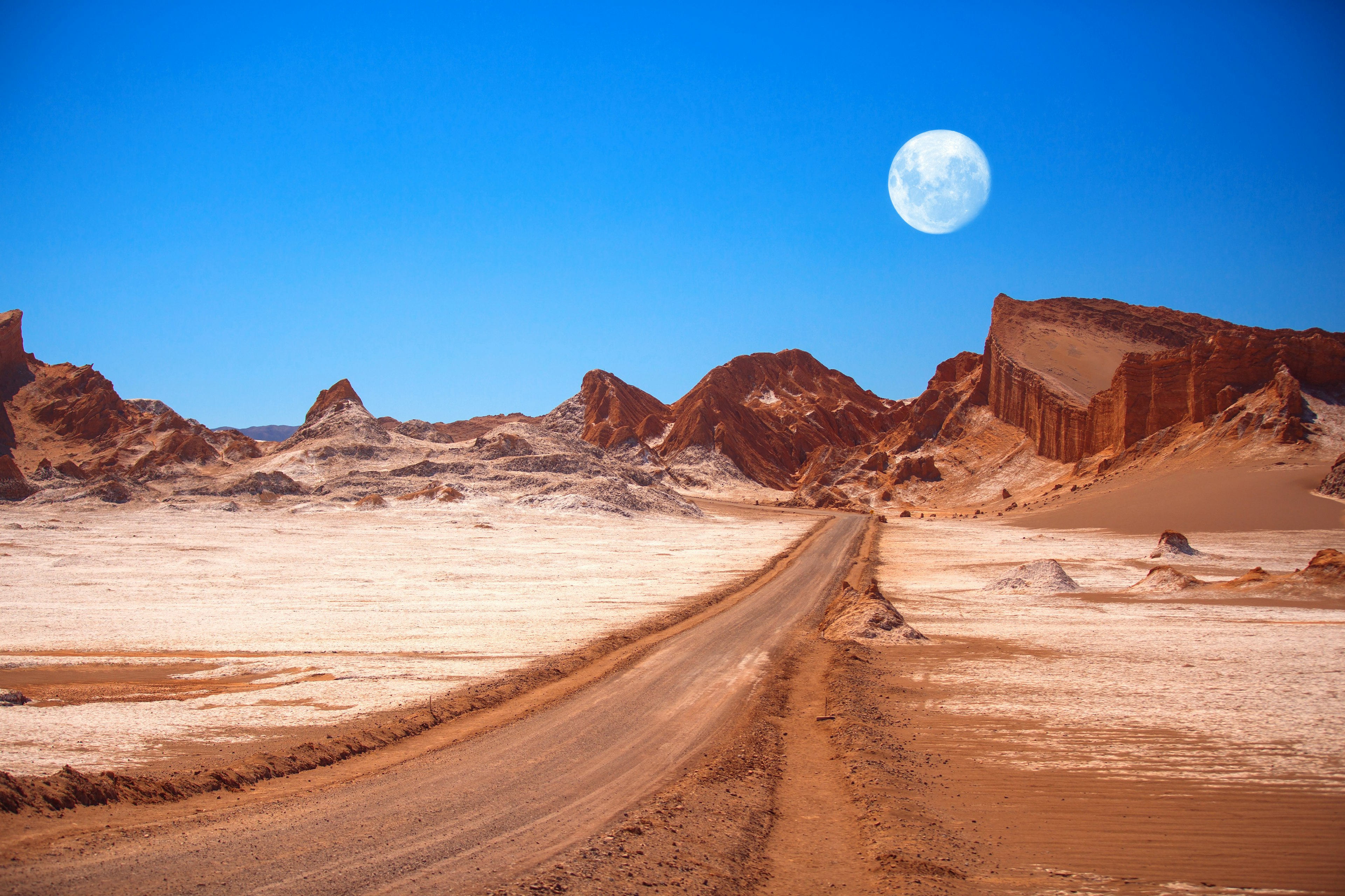 The moon rises above the amphitheatre, a geological formation in Moon Valley..