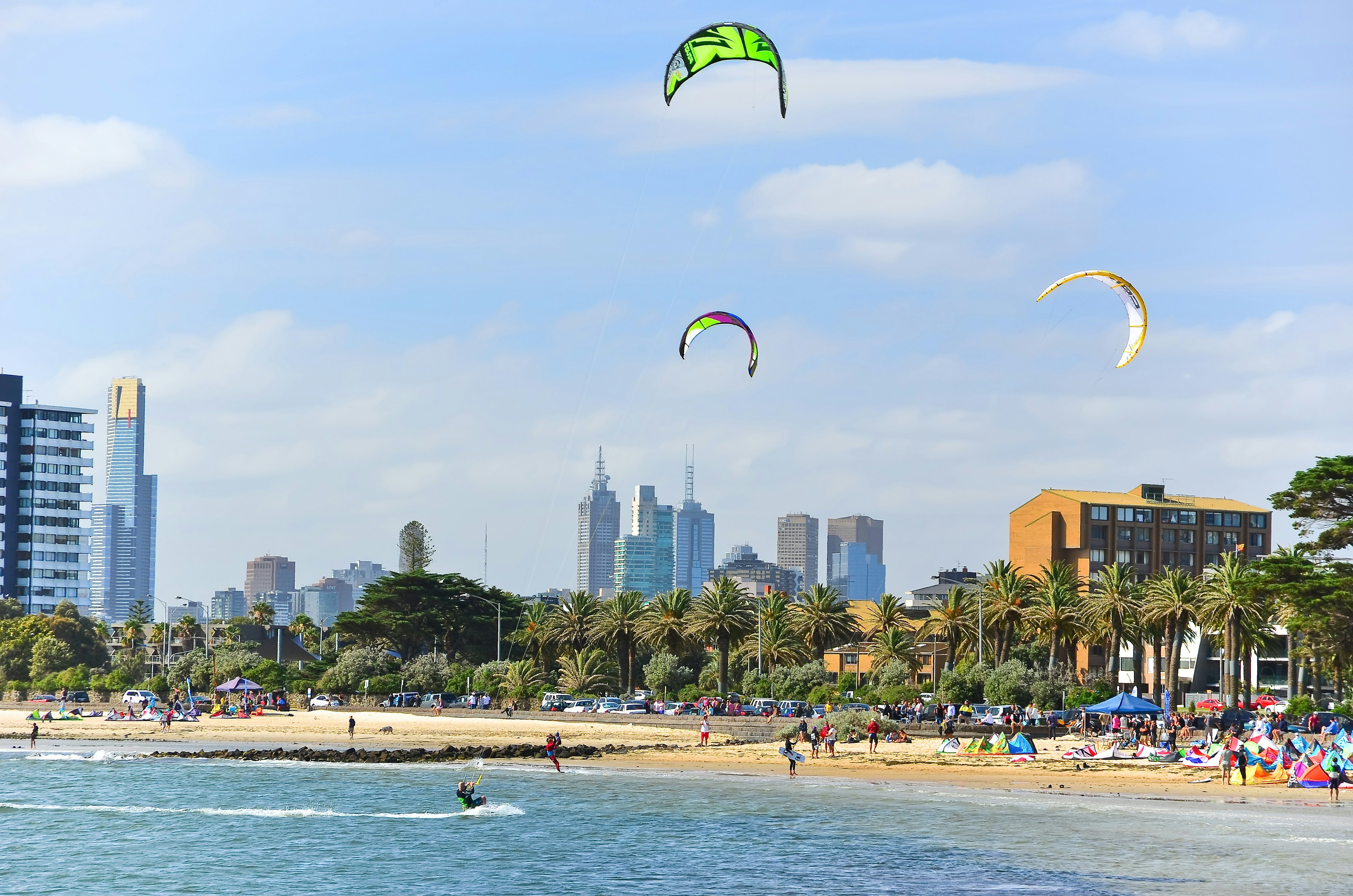 People kite surfing on St Kilda Beach in Melbourne.