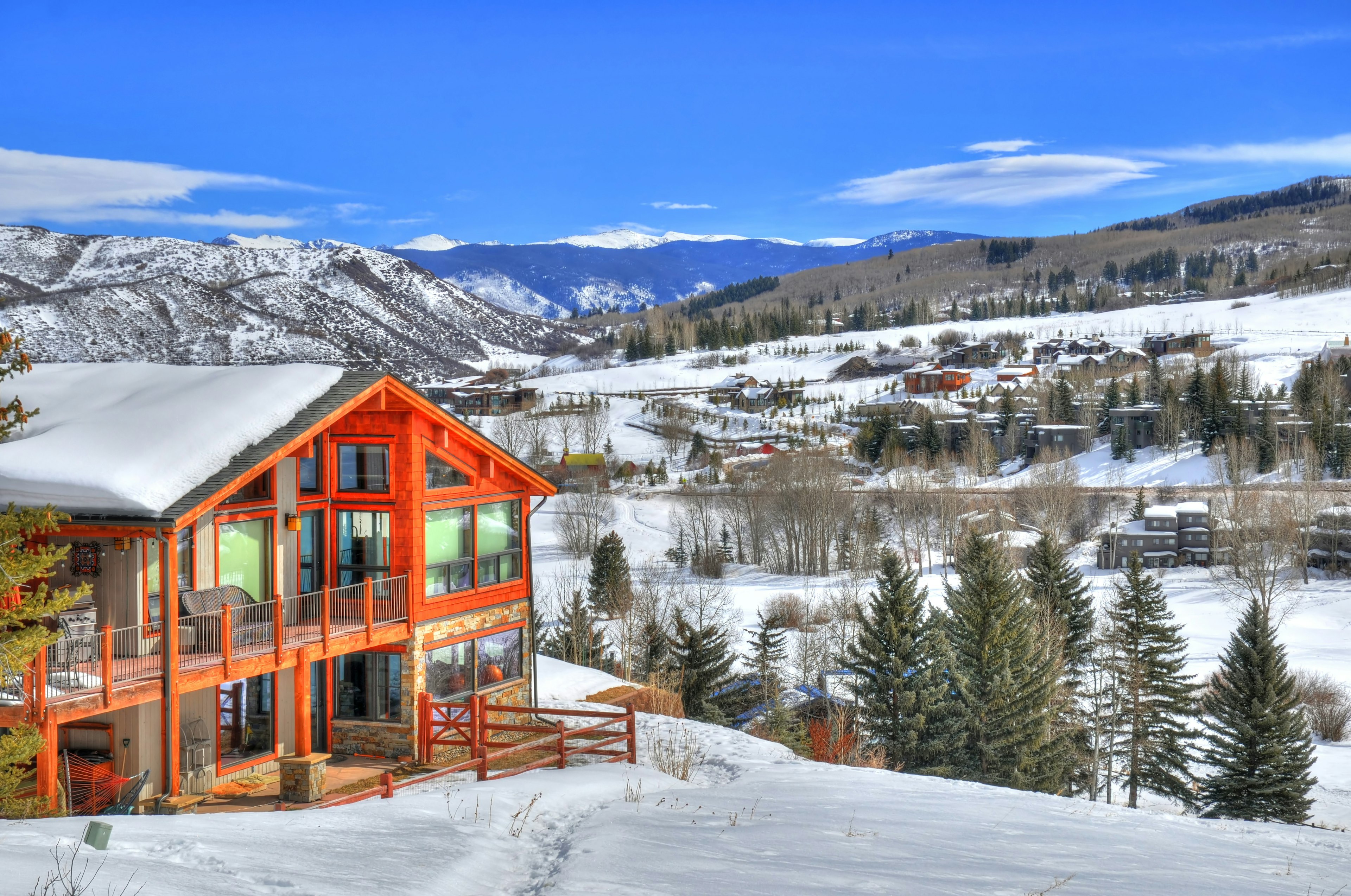 Beautiful colorful landscape in Snowmass - a ski resort with a background of a small residential area (small huts) surrounded by trees (HDR image) in Aspen Colorado