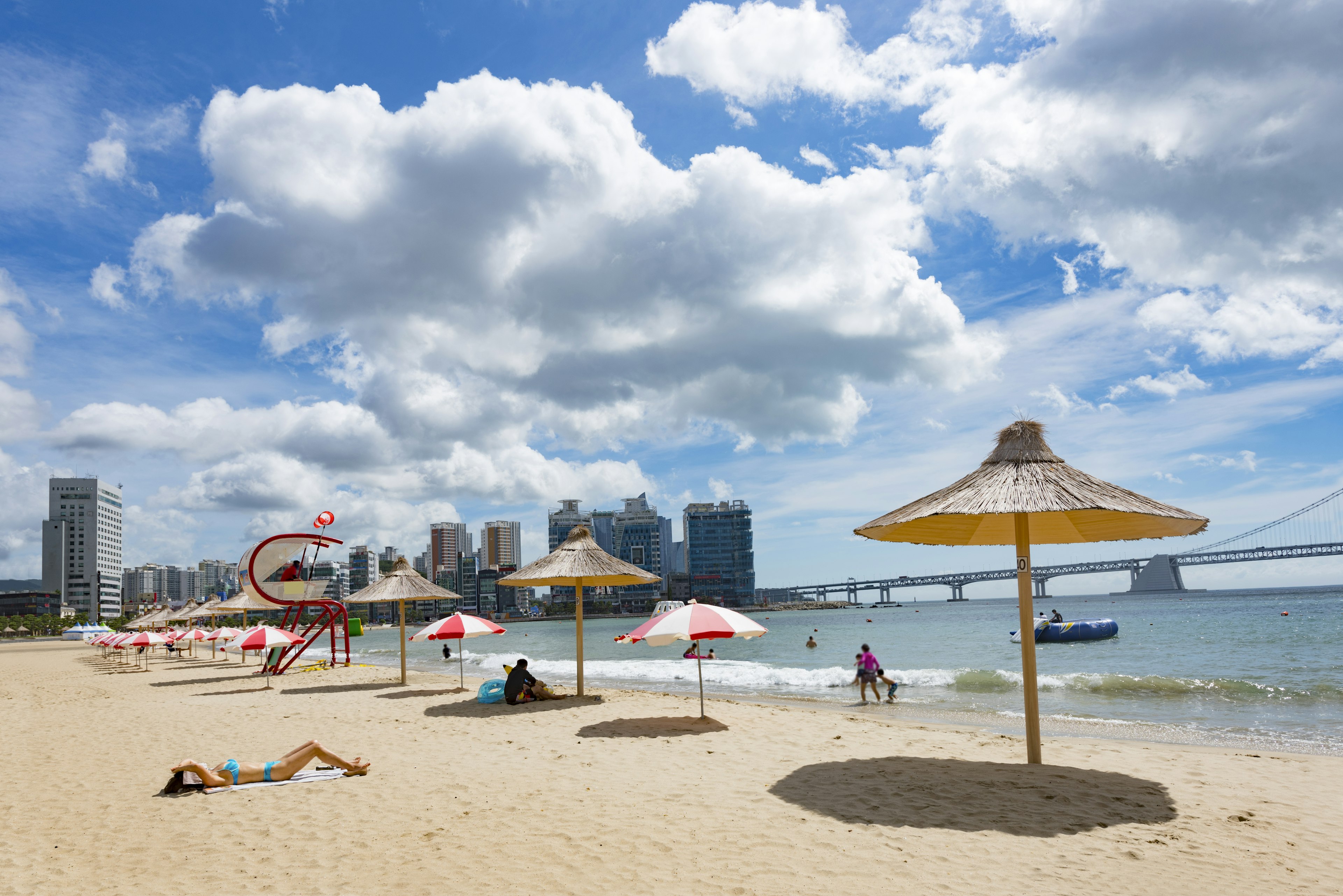 Sunbathers on Gwangalli Beach in Busan, South Korea