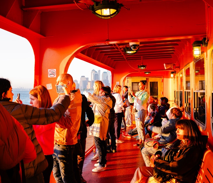 Anthony Nazario for Lonely Planet
The Staten Island Ferry from Staten Island, NY to Manhattan. Commuters and tourists enjoy the setting sun.