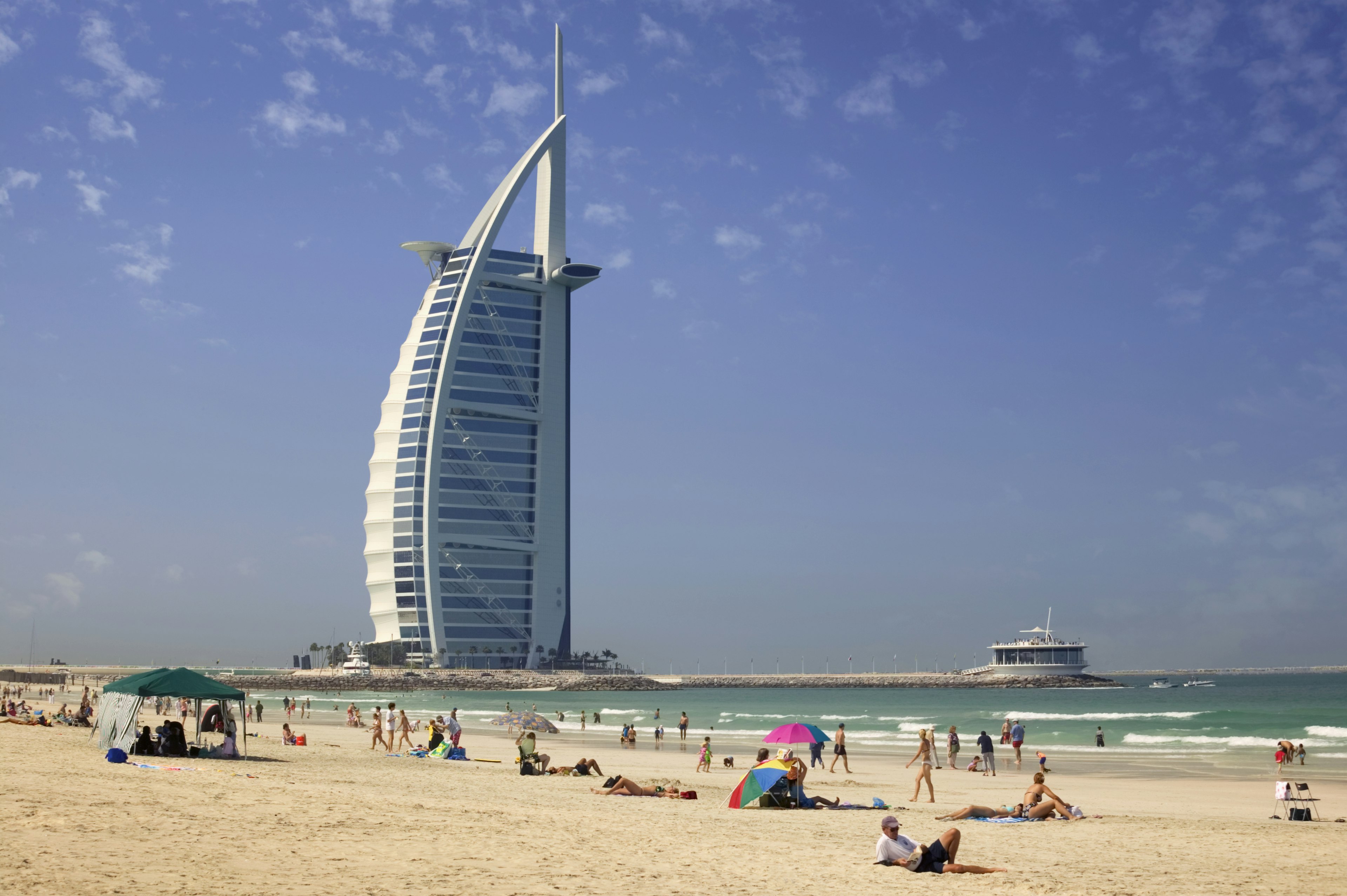 Visitors enjoy the sun at Sunset Beach in Dubai, United Arab Emirates