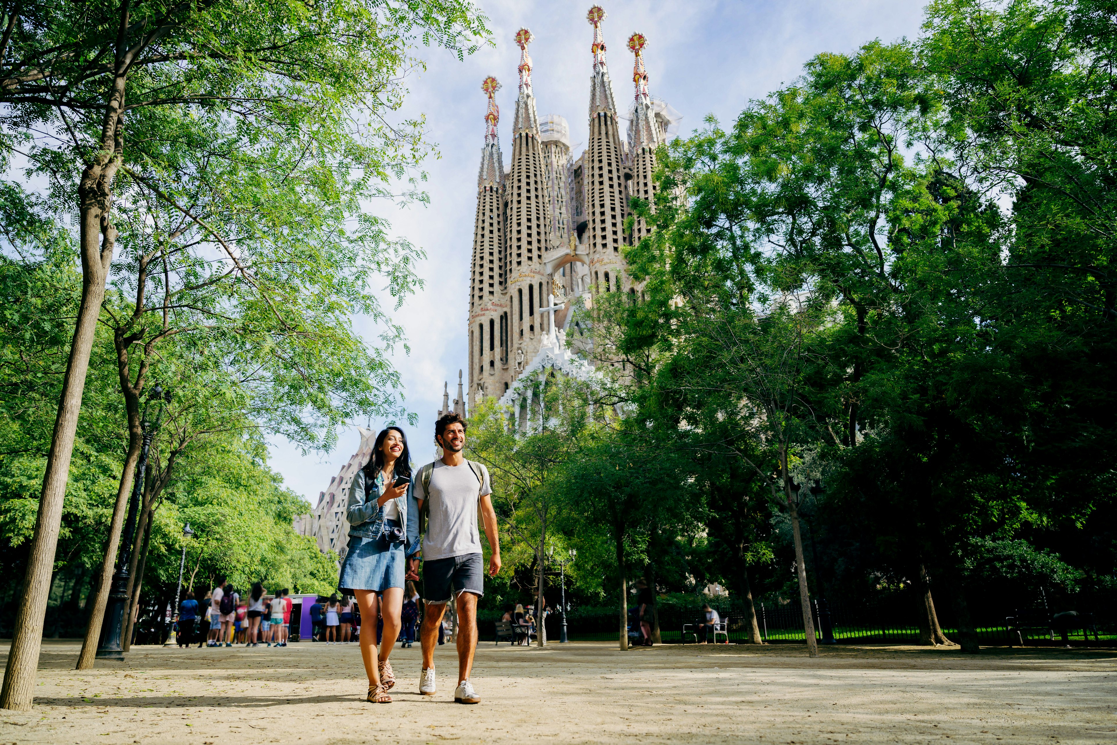 Walking through a Barcelona park near Sagrada Familia.