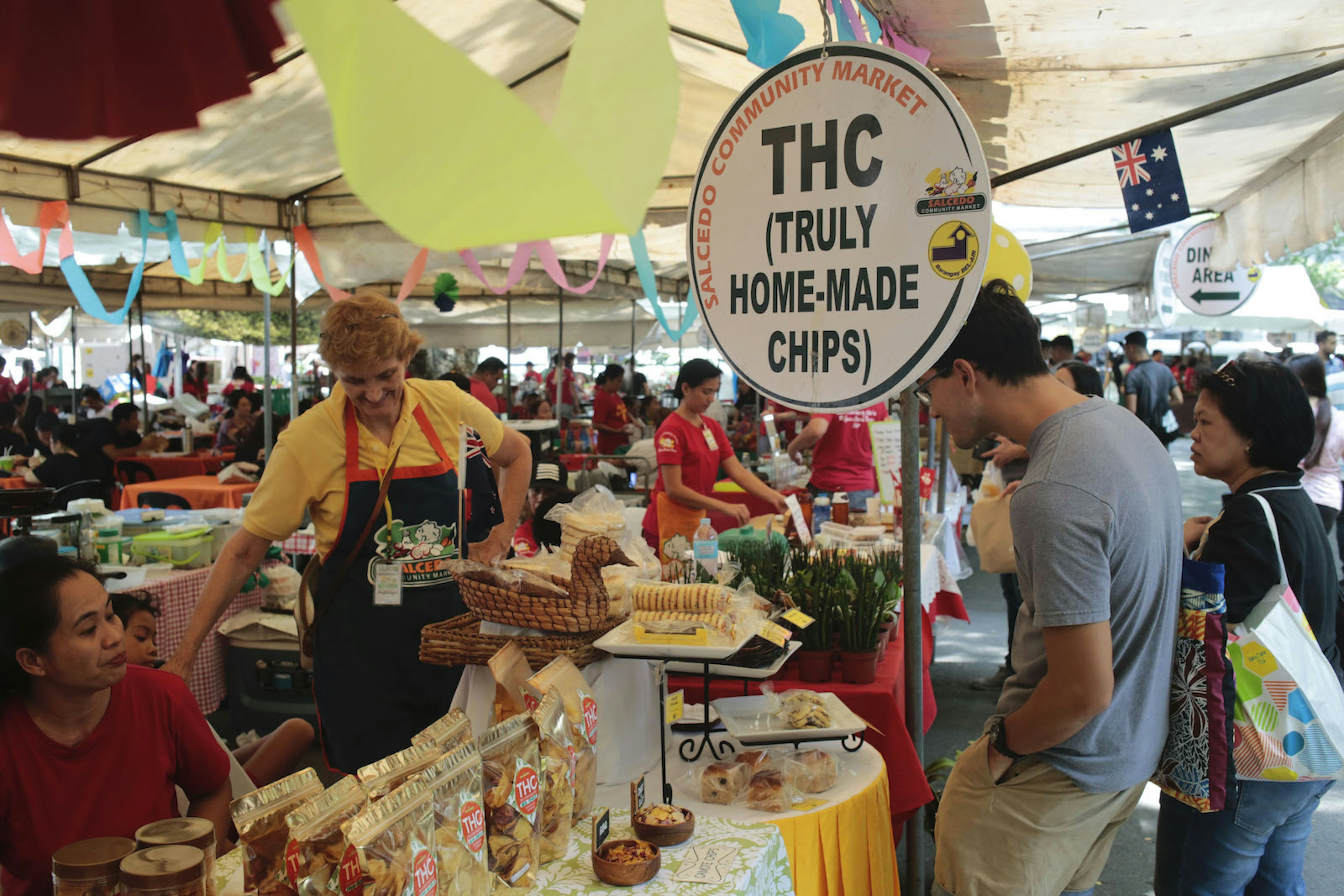 Vendors and shoppers at the Truly Handmake Chips stall in the market