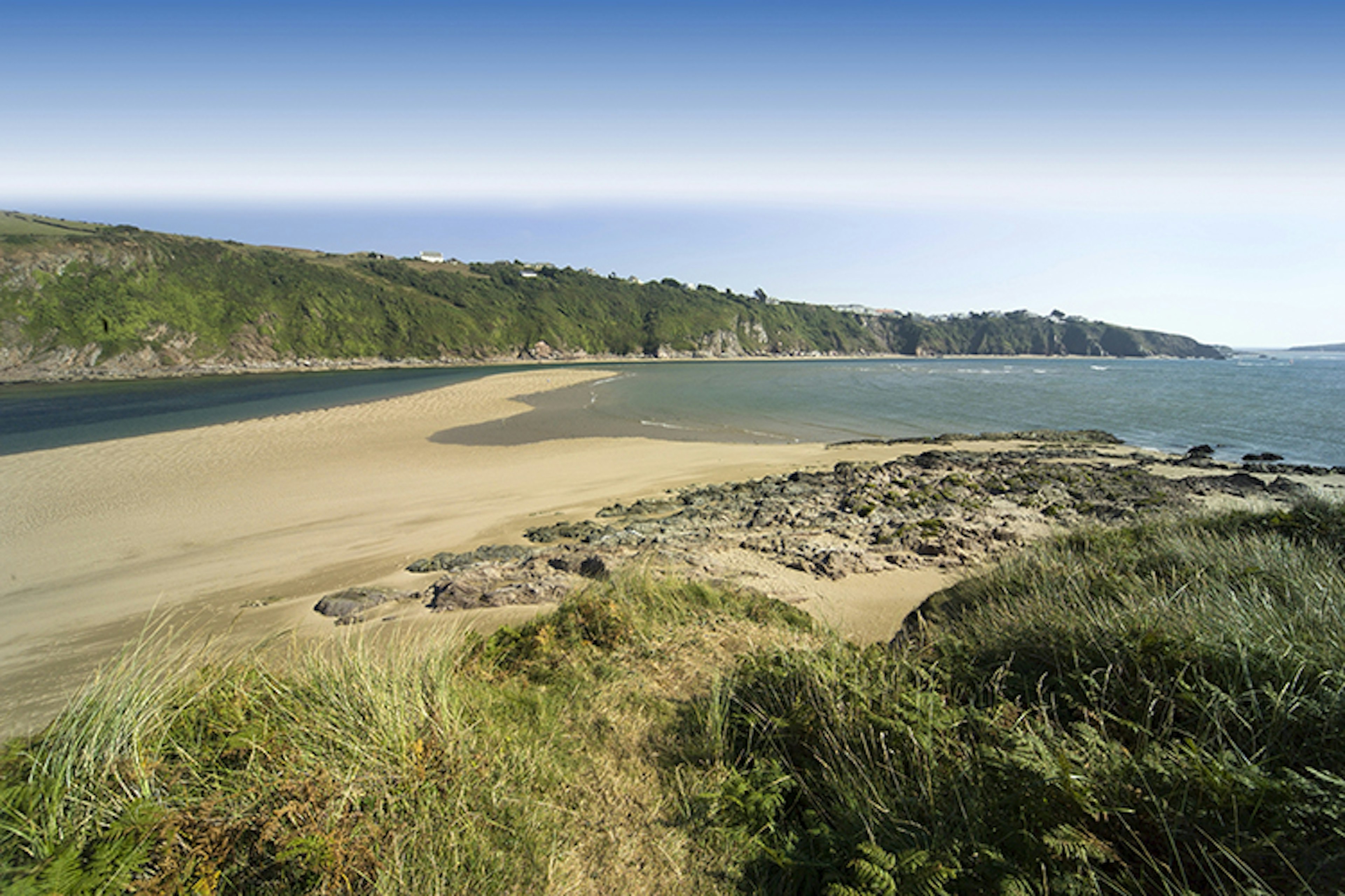 Devon's Bantham Beach is an all-rounder with  waves, sandy spots, dunes, rock pools and more. Image by Ann Taylor-Hughes / iStock / Getty Images