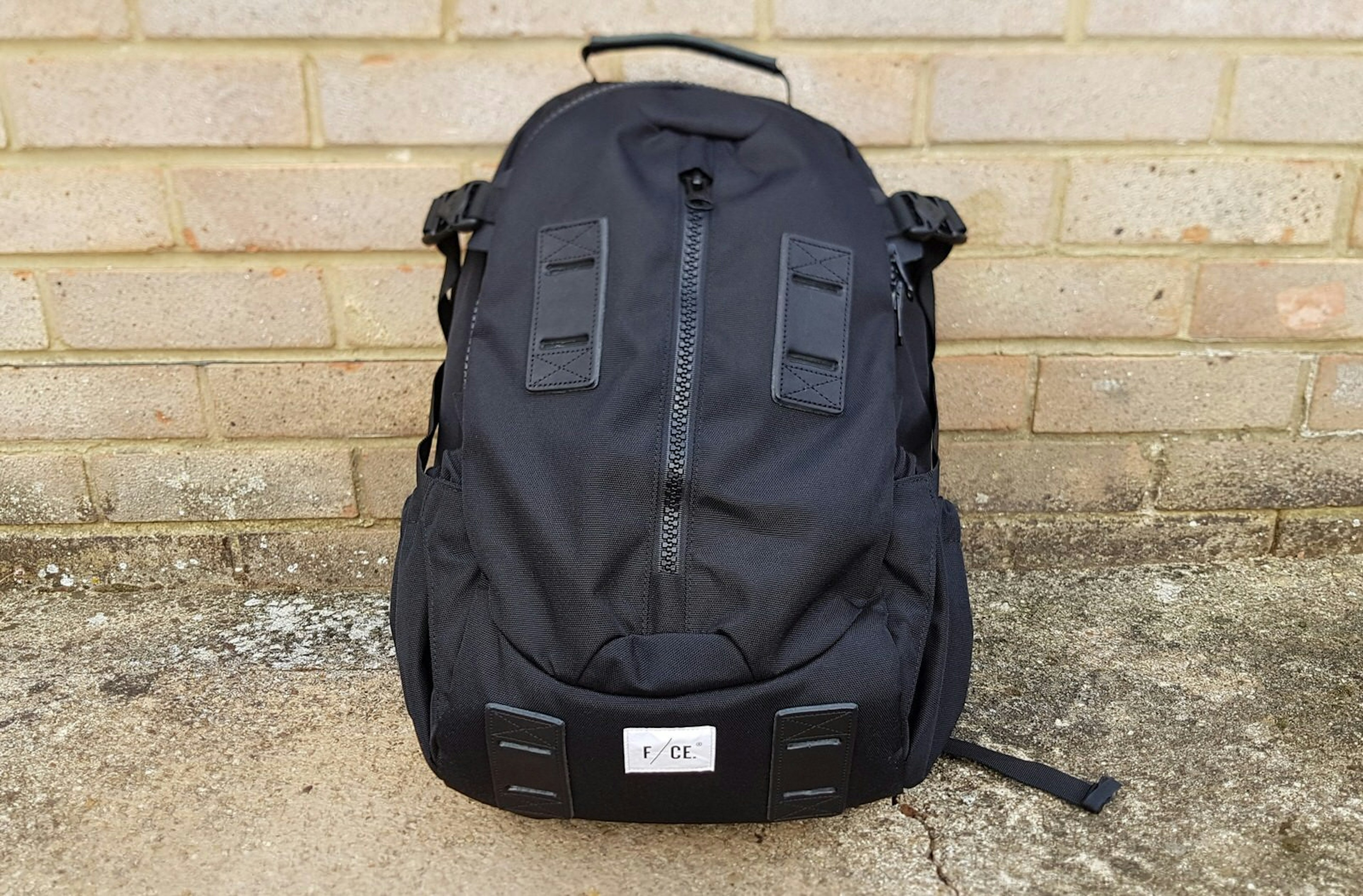 The 950 Travel Backpack from F/CE, a black backpack with three main compartments